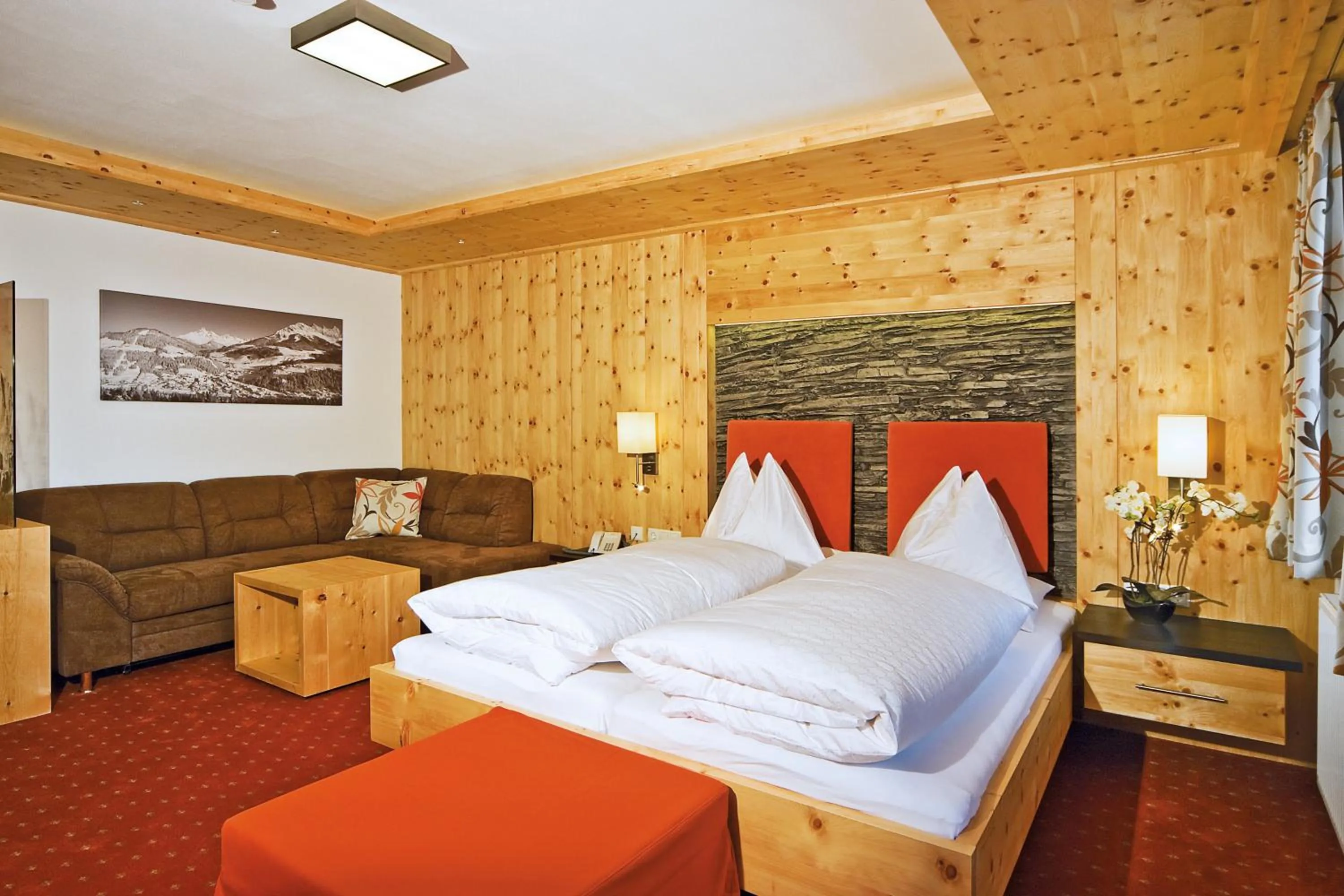 Photo of the whole room, Bed in Landhotel Alpenhof Filzmoos