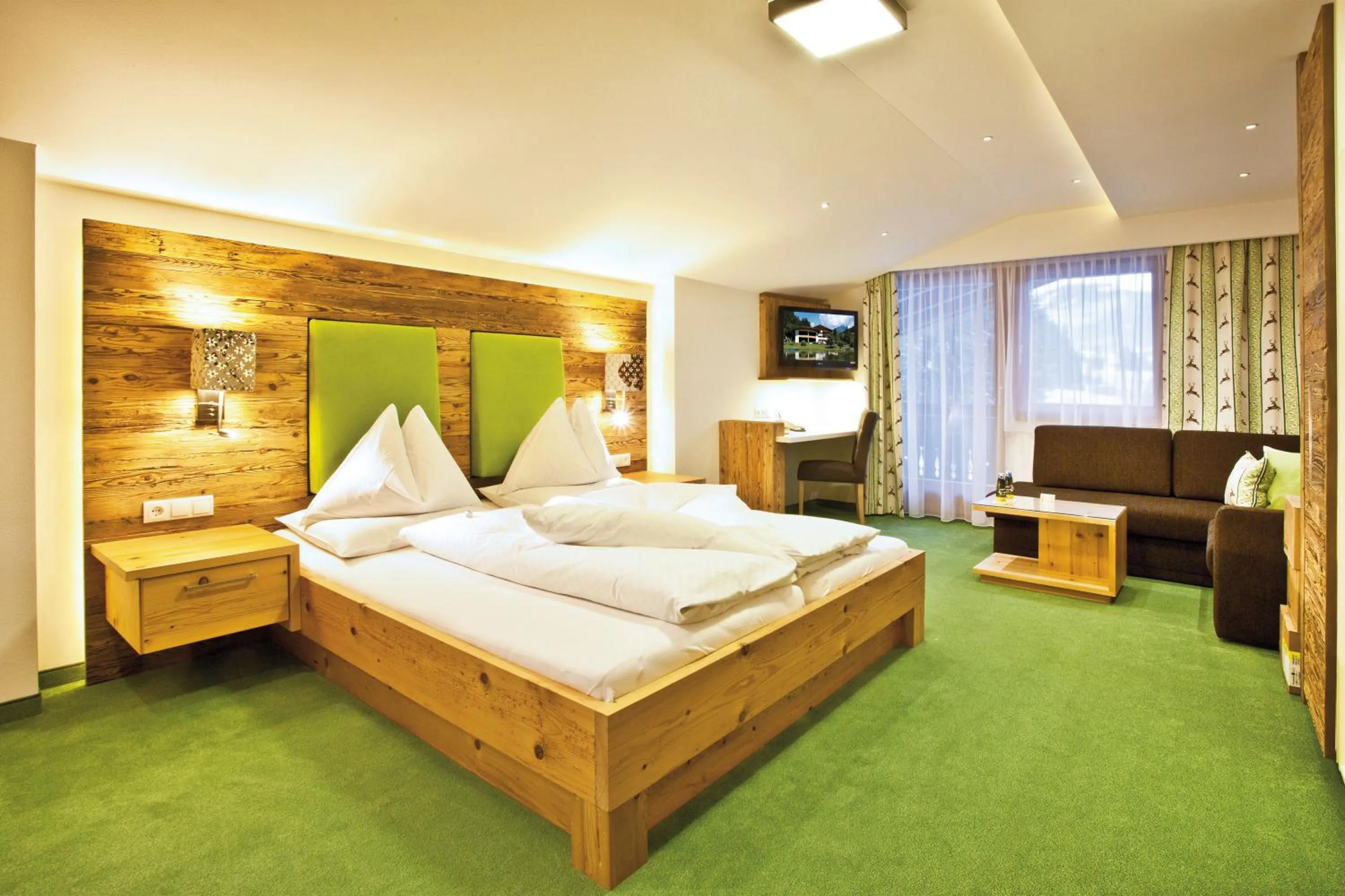 Photo of the whole room, Bed in Landhotel Alpenhof Filzmoos