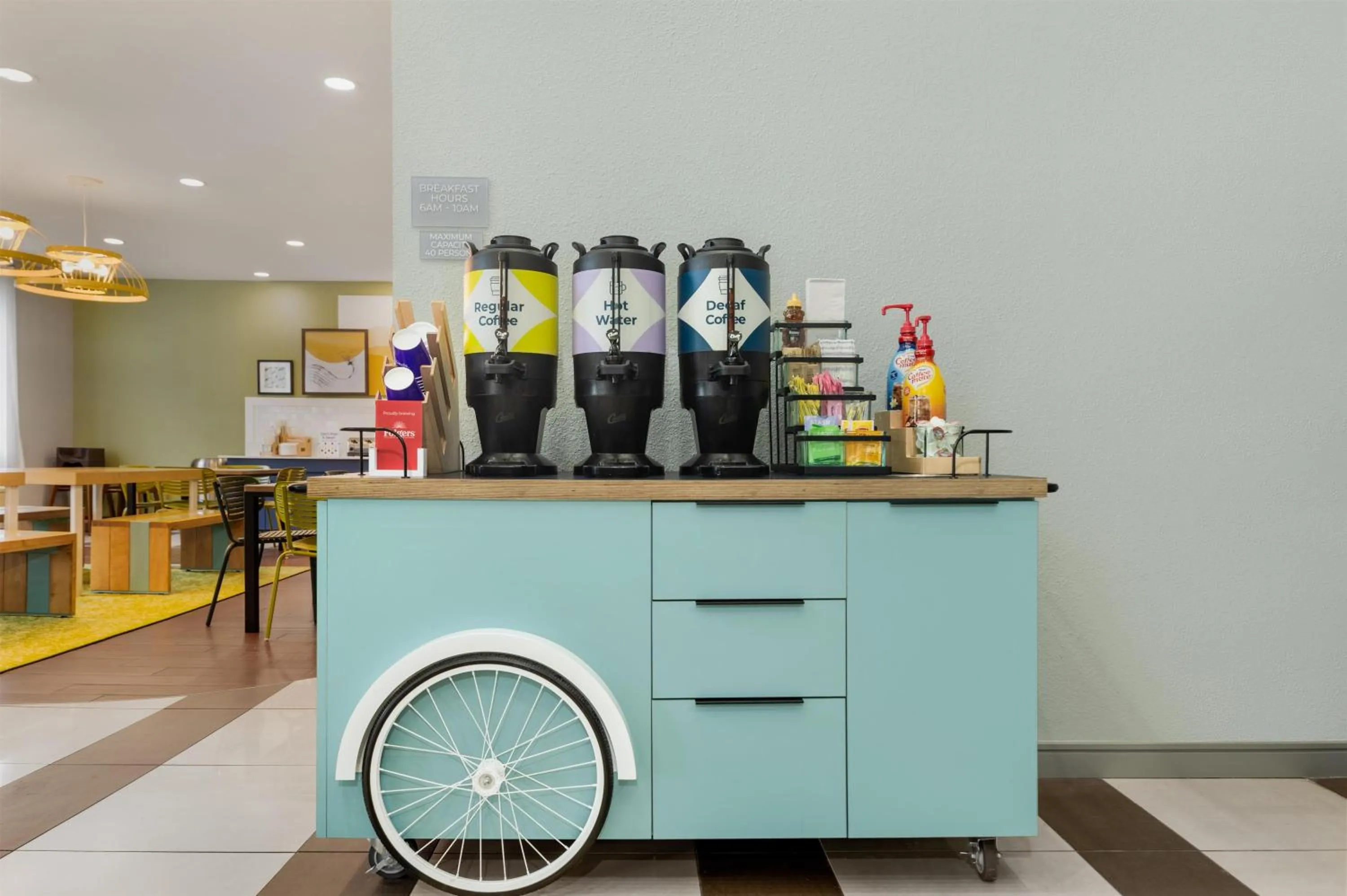 Dining area in Spark by Hilton Indianapolis Northeast Fishers