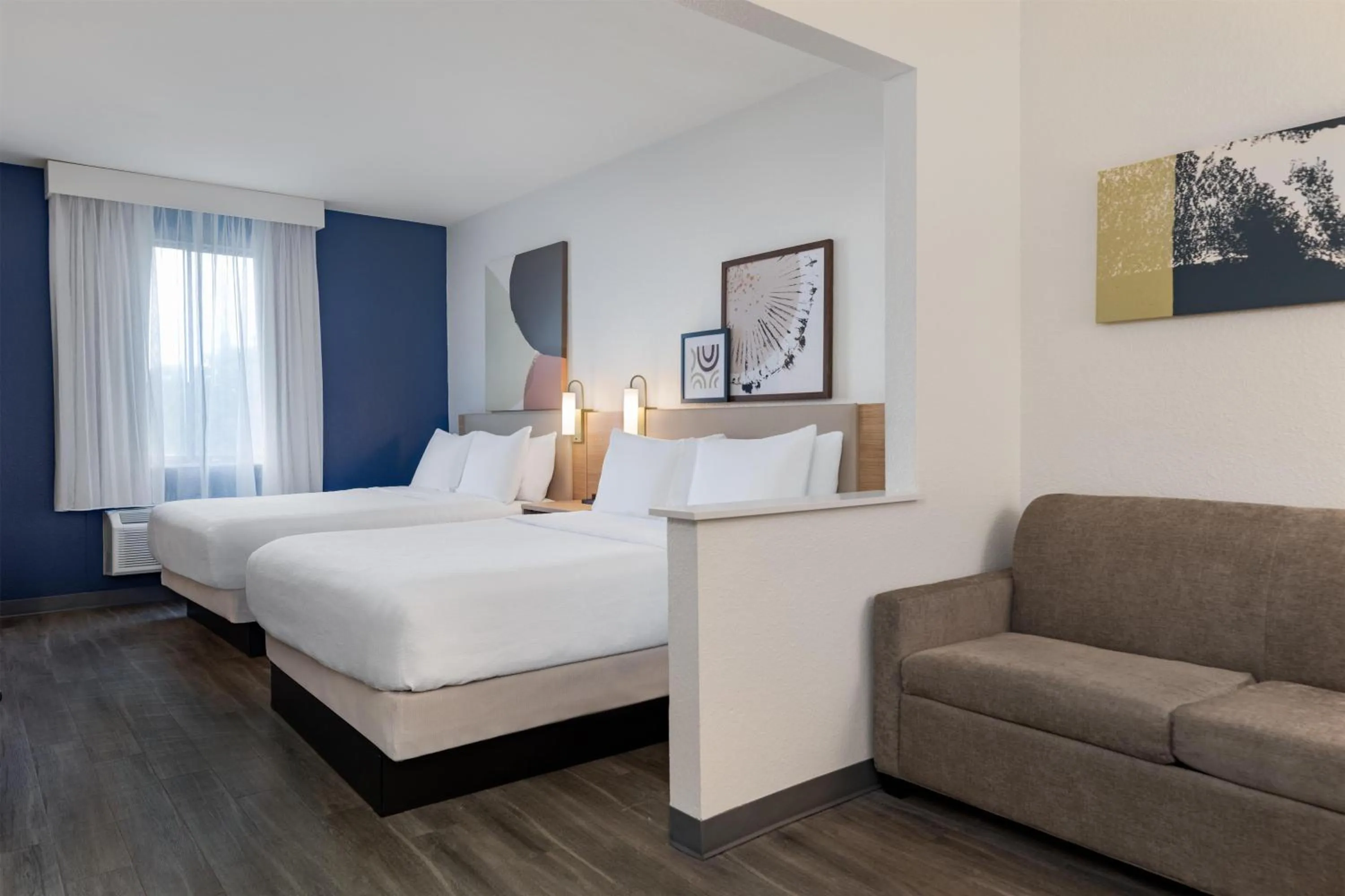 Living room, Bed in Spark by Hilton Indianapolis Northeast Fishers