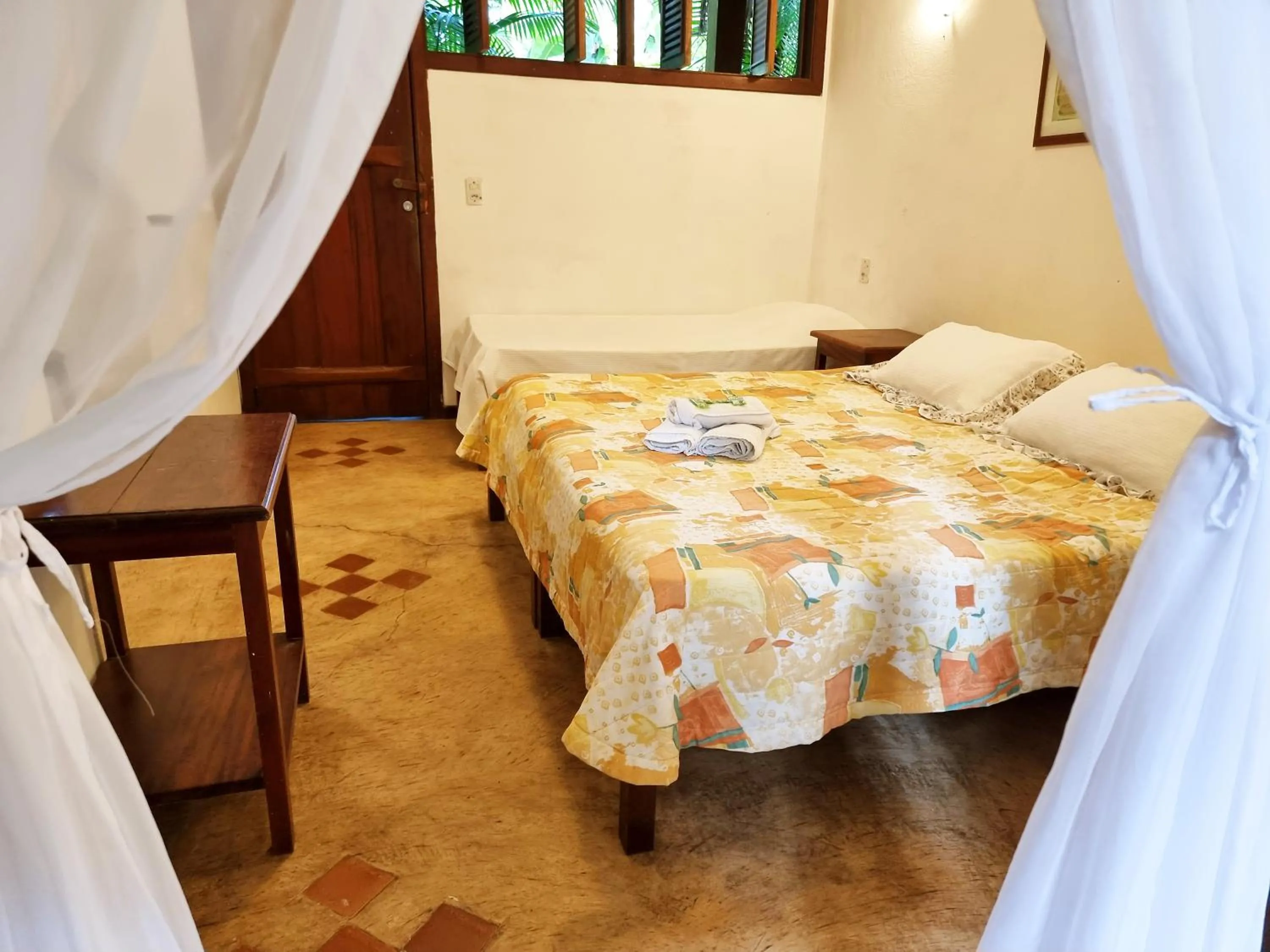 Bed in Pousada Rumo dos Ventos