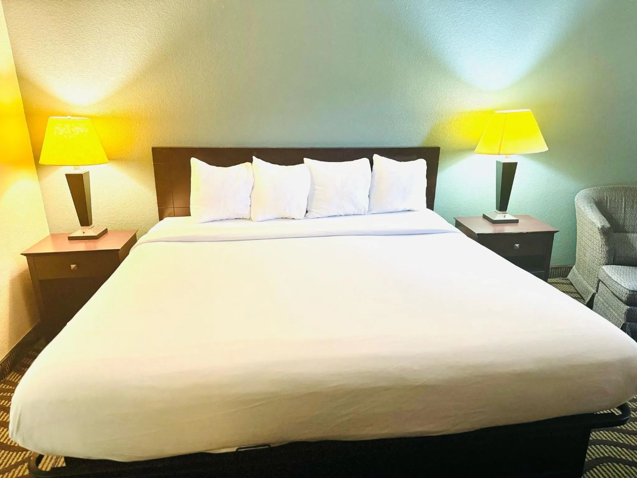 Bed in Baymont Inn & Suites by Wyndham Lincoln NE