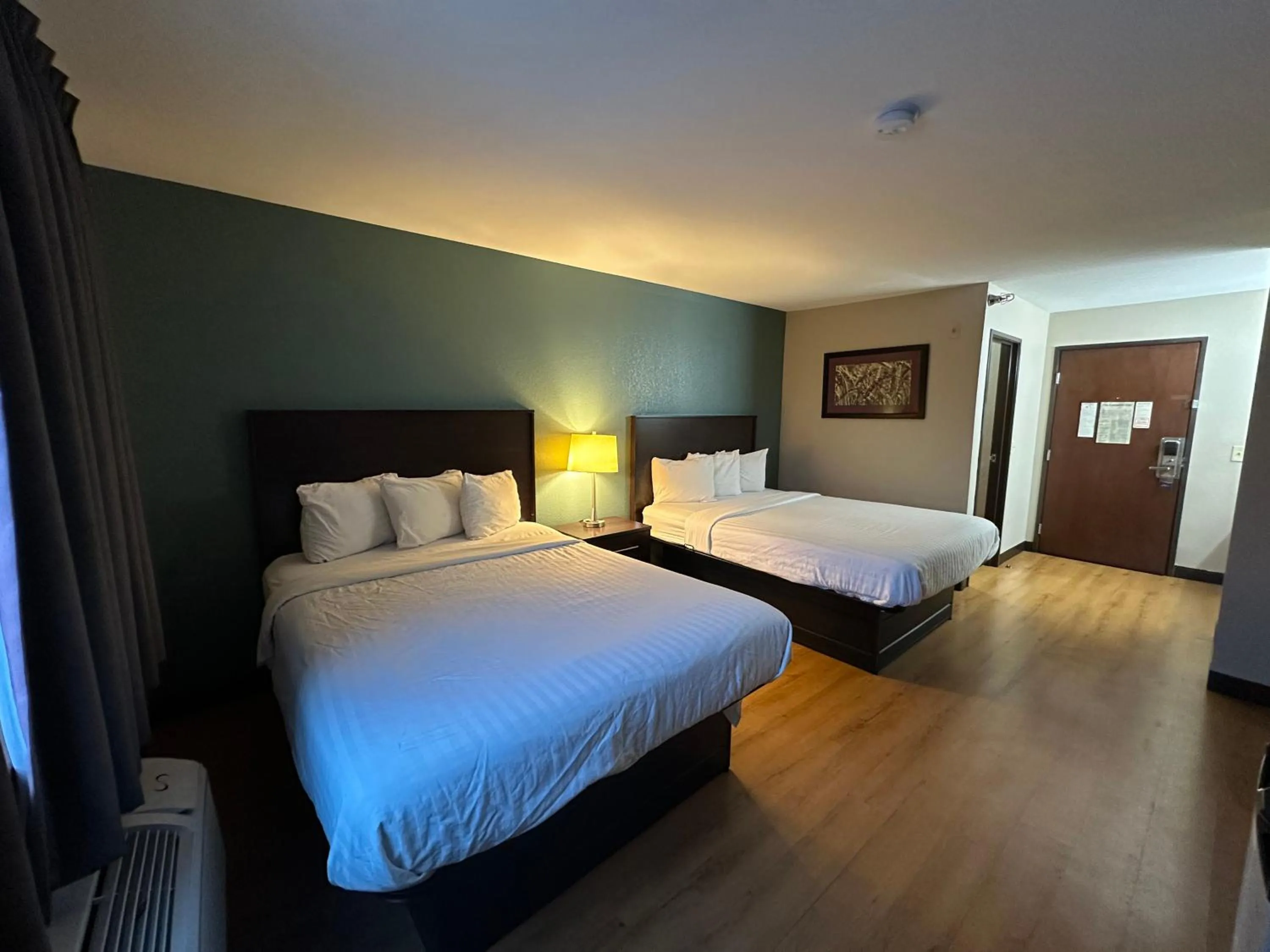 Bed in Baymont Inn & Suites by Wyndham Lincoln NE