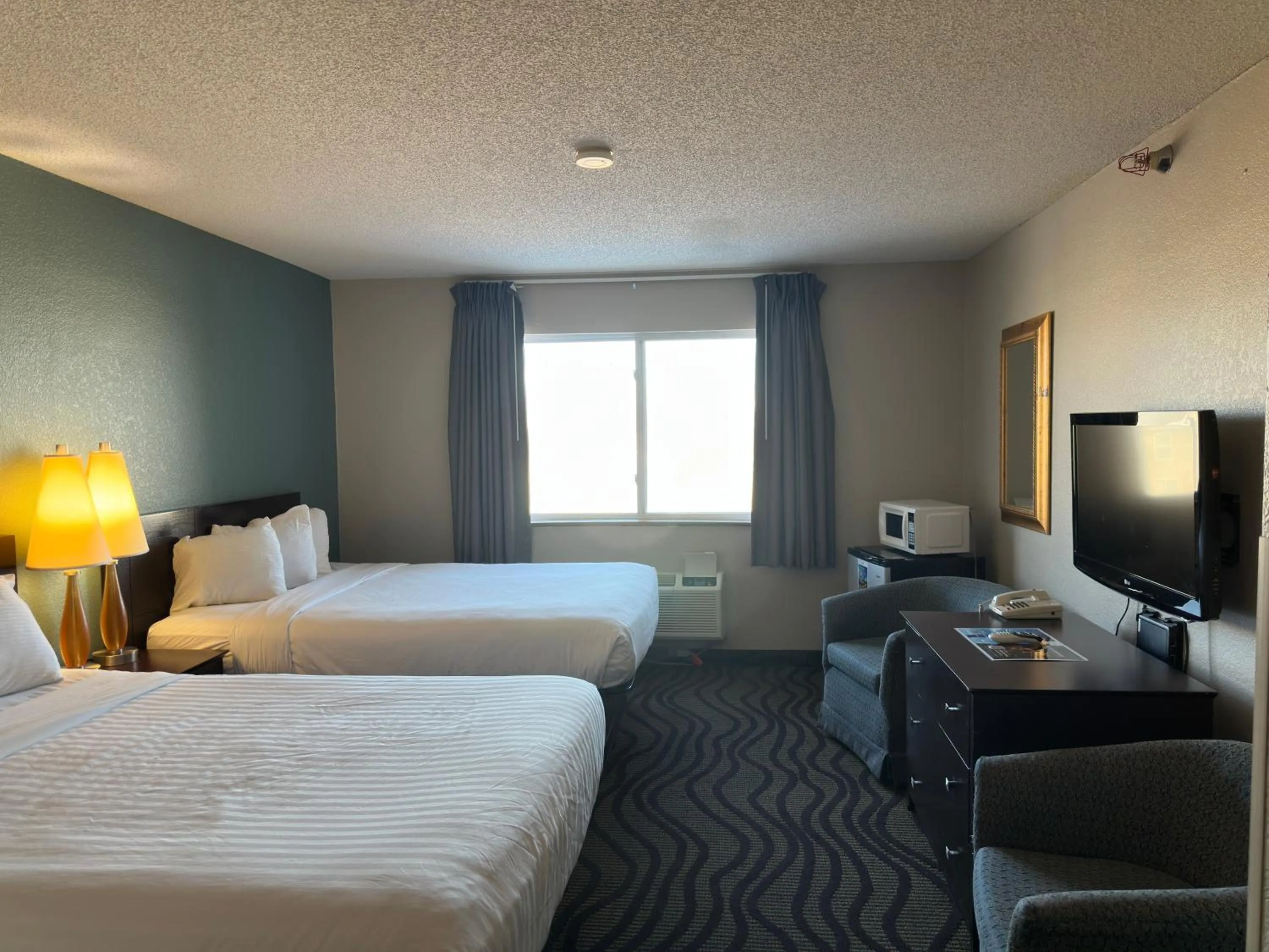 Bed in Baymont Inn & Suites by Wyndham Lincoln NE