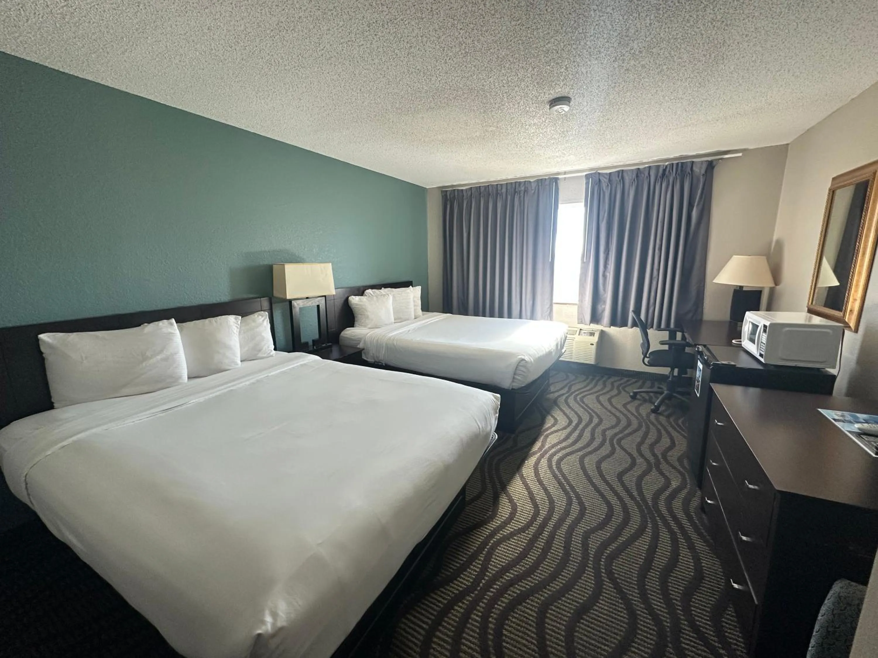Bed in Baymont Inn & Suites by Wyndham Lincoln NE