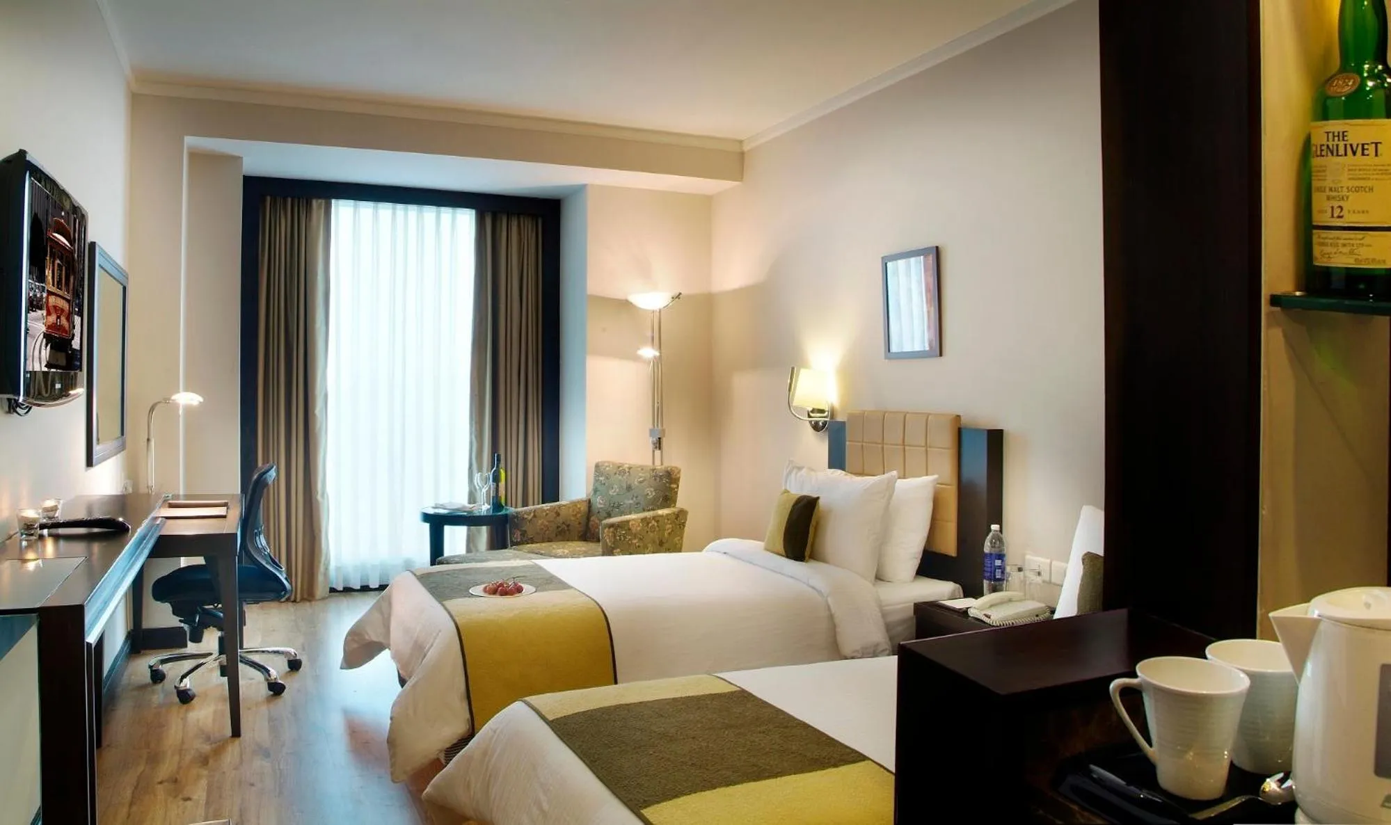 Photo of the whole room, Bed in Goldfinch Hotel Delhi NCR