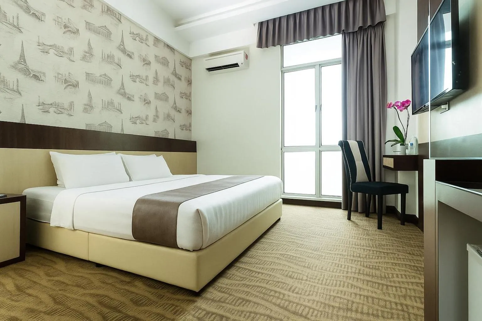 Bed in THE REED HOTEL MELAKA formerly known as E-Red Hotel Melaka