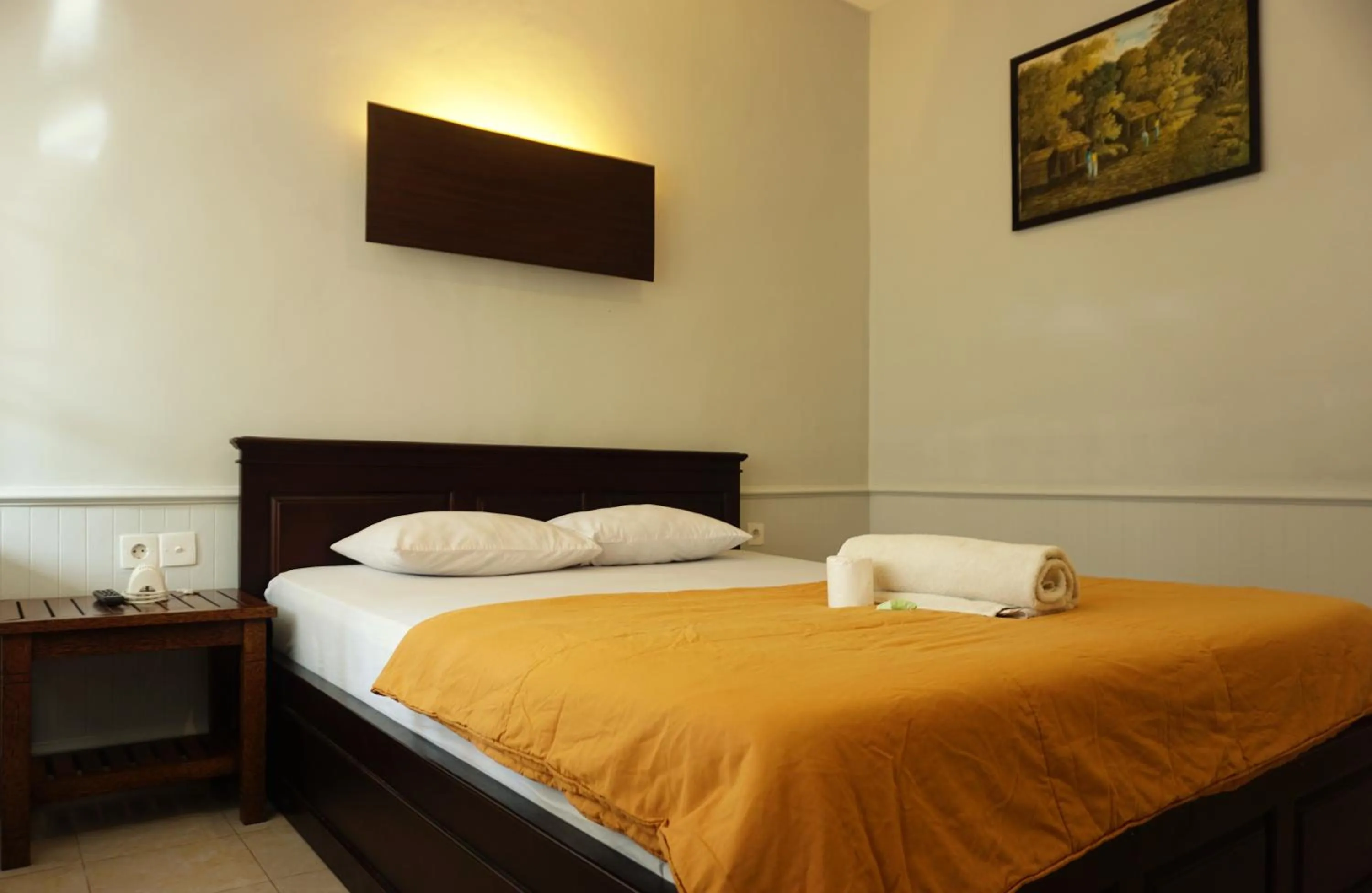 Bed in Sari Indah Cottages