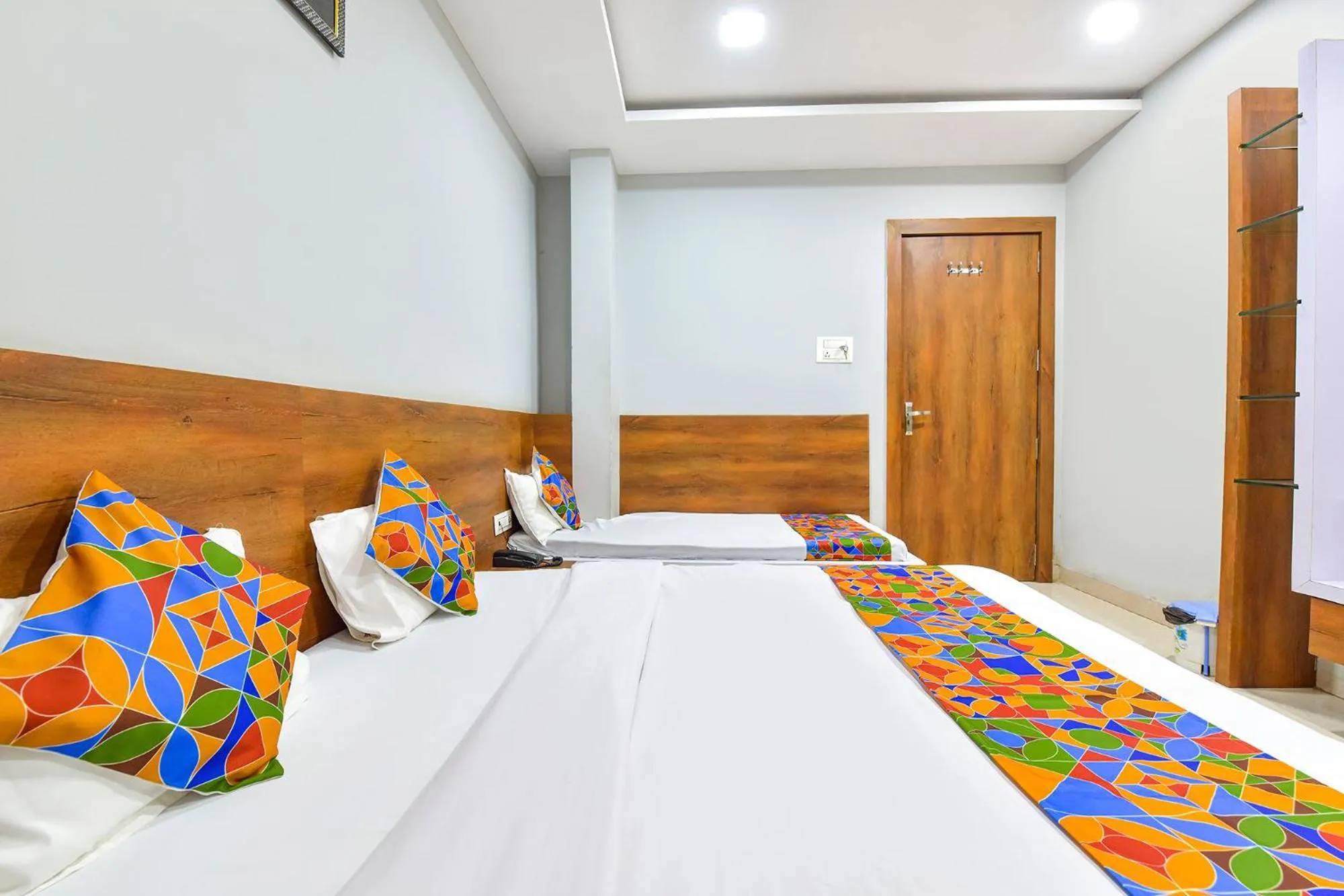 Bed in FabHotel Raghumani Palace - Nr Mahakal Mandir