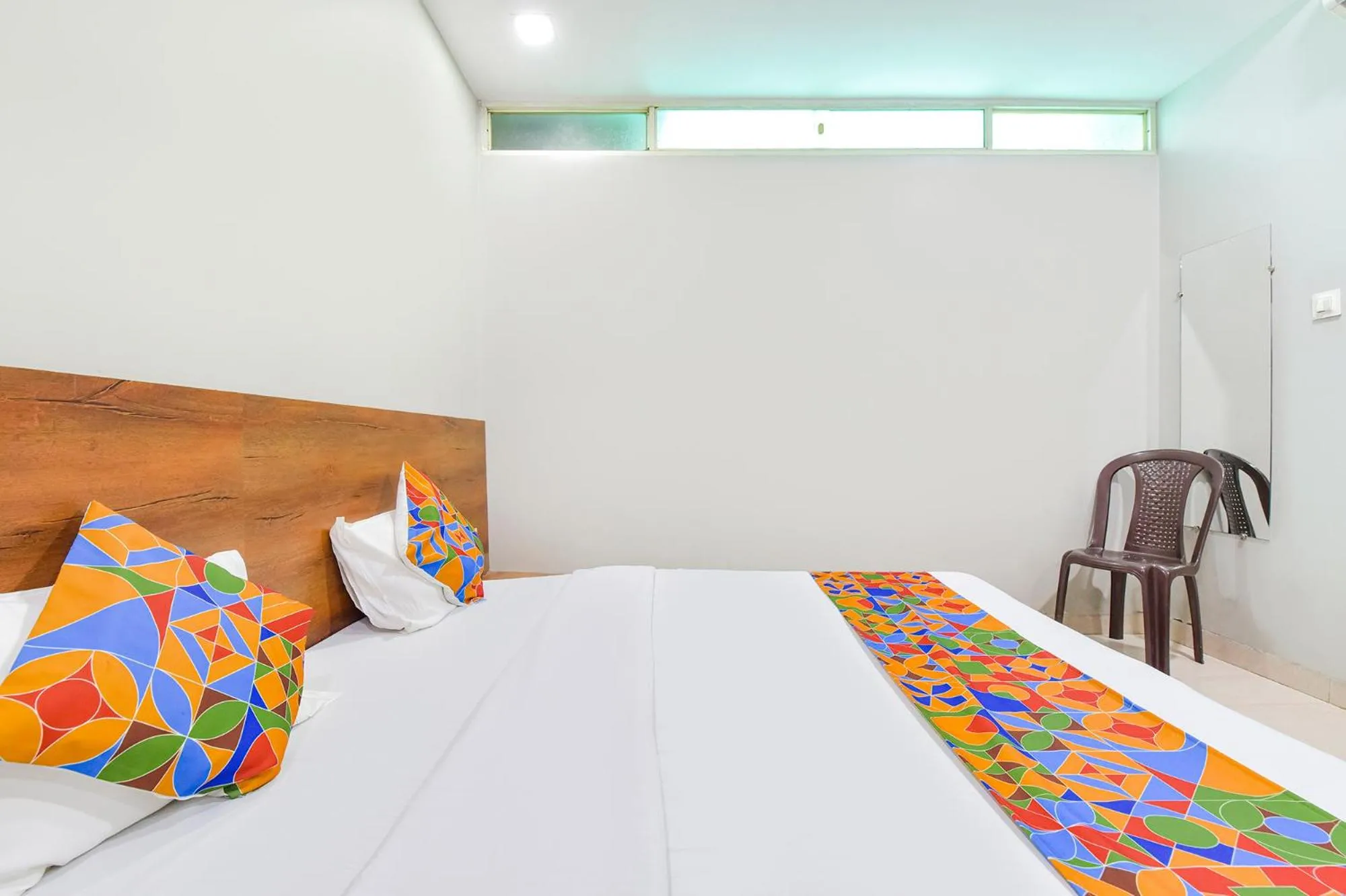 Bed in FabHotel Raghumani Palace - Nr Mahakal Mandir