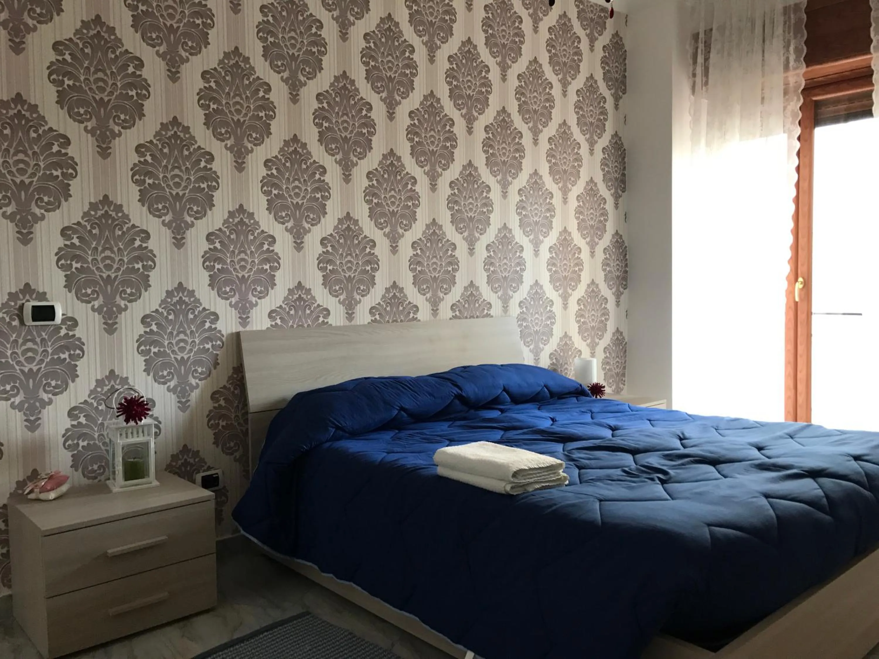 Bed in Supera Napoli Apartment