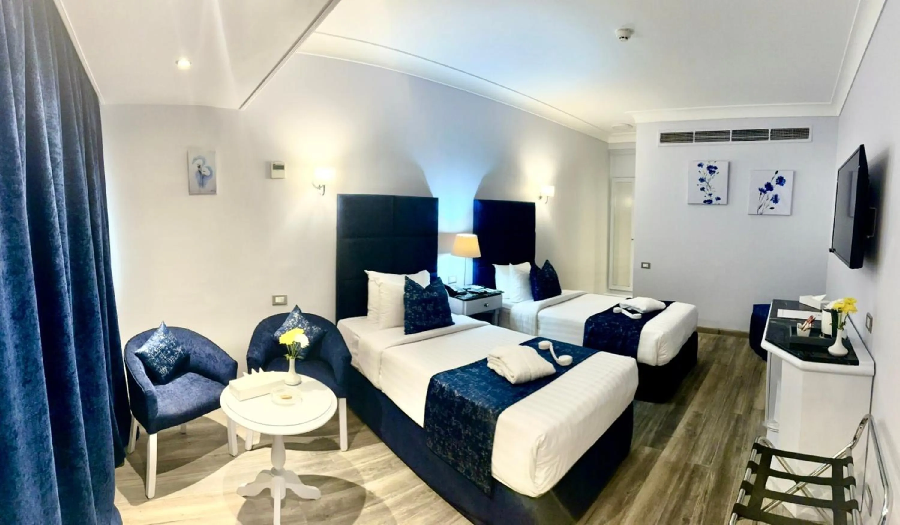 Living room, Bed in Paradise Inn Beach Resort