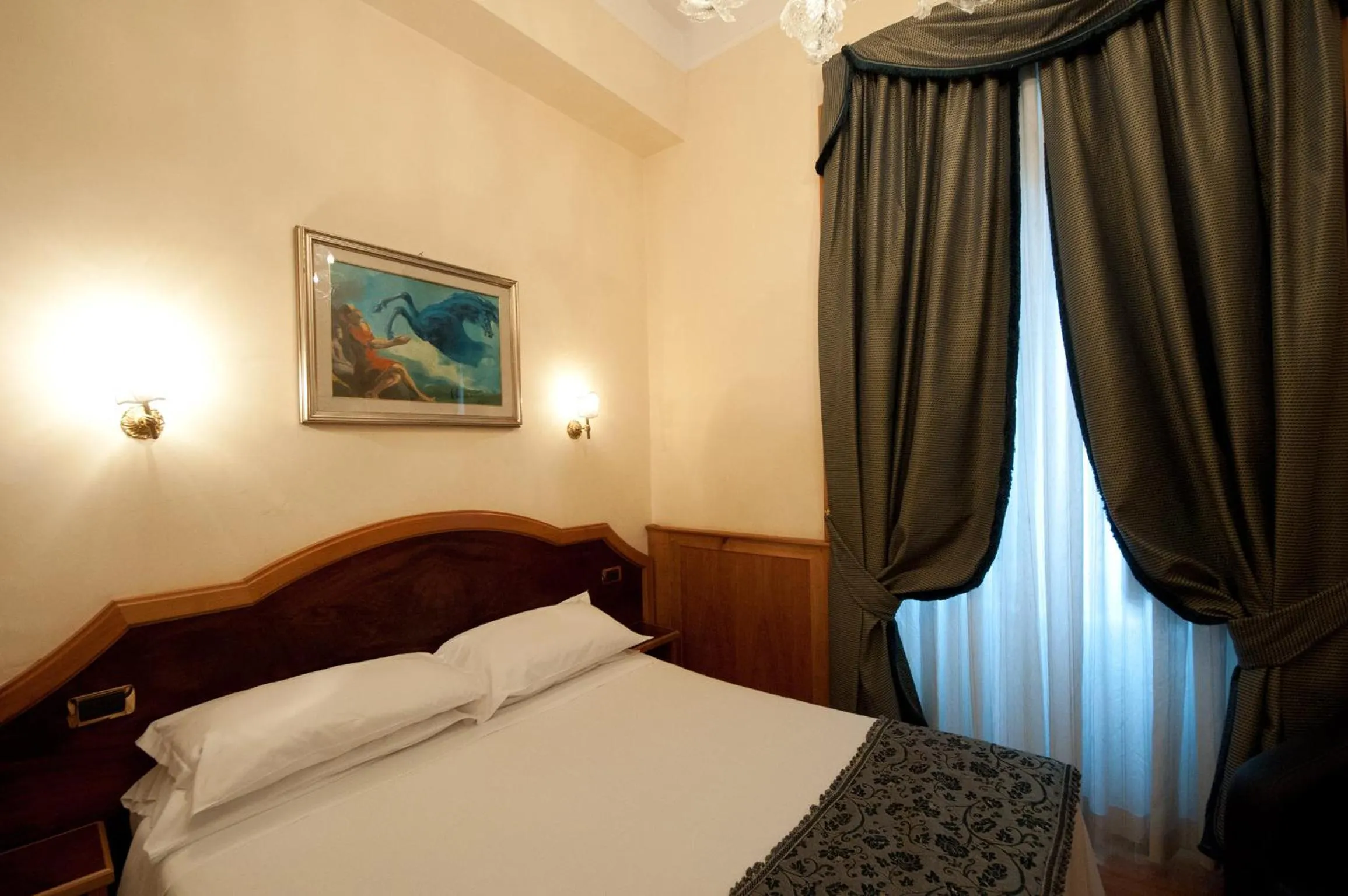 Bed in Relais Conte Di Cavour De Luxe