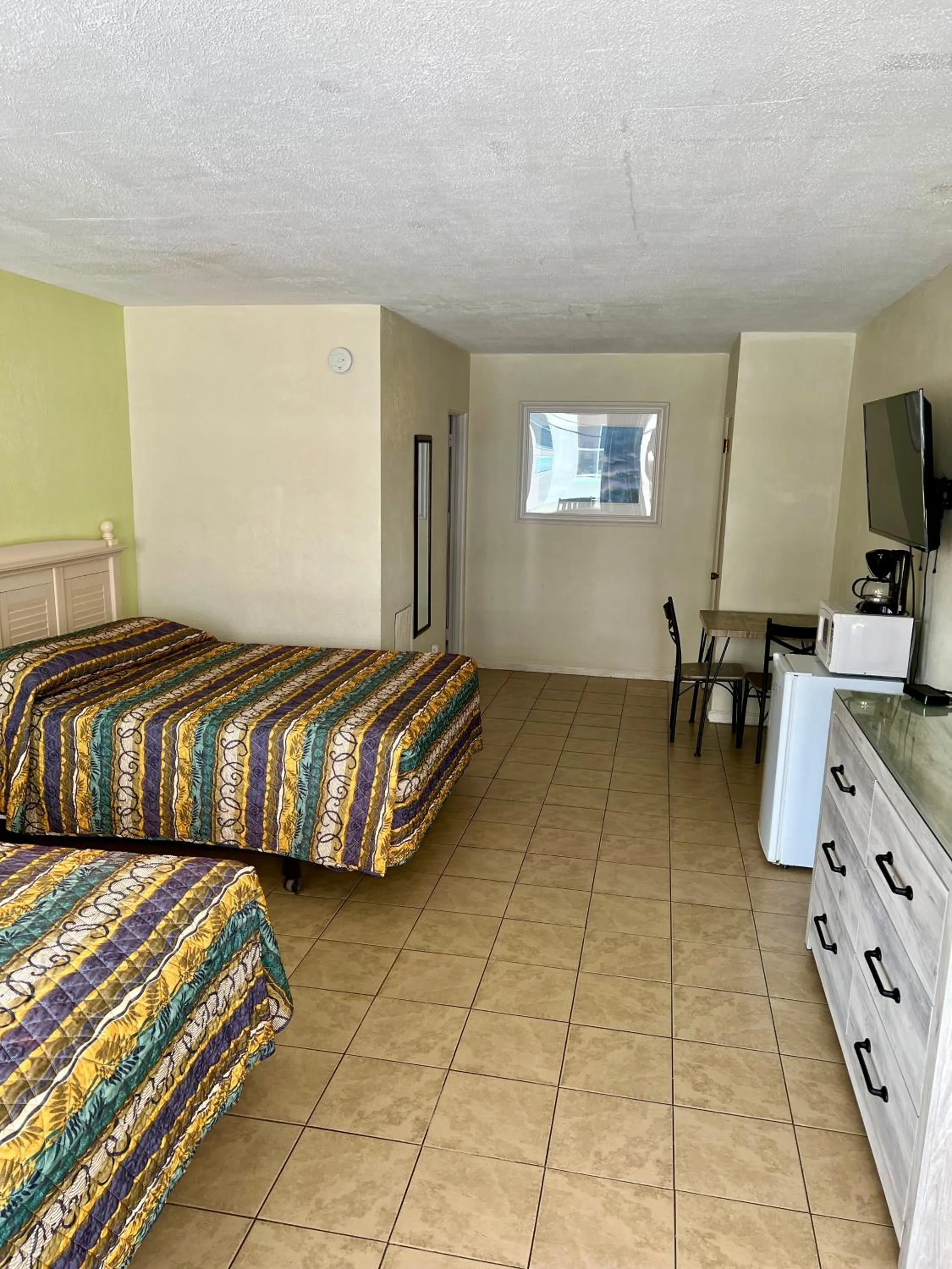 Bed in Beach Colony Motel