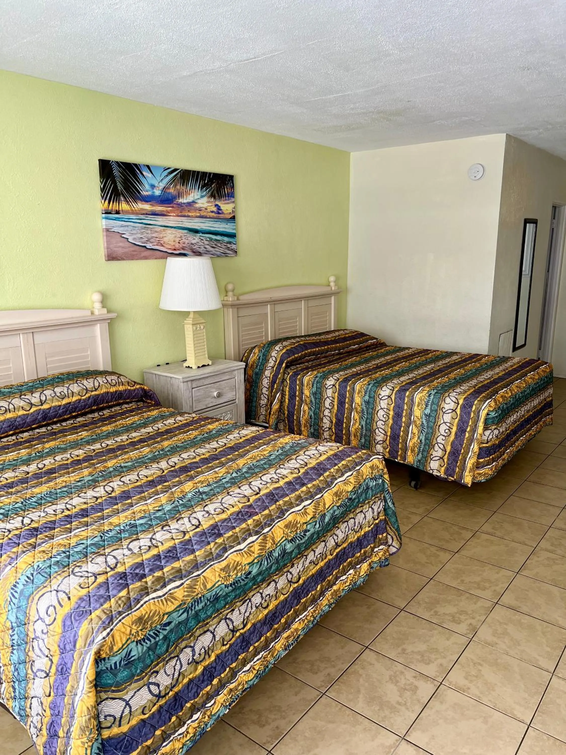 Bed in Beach Colony Motel