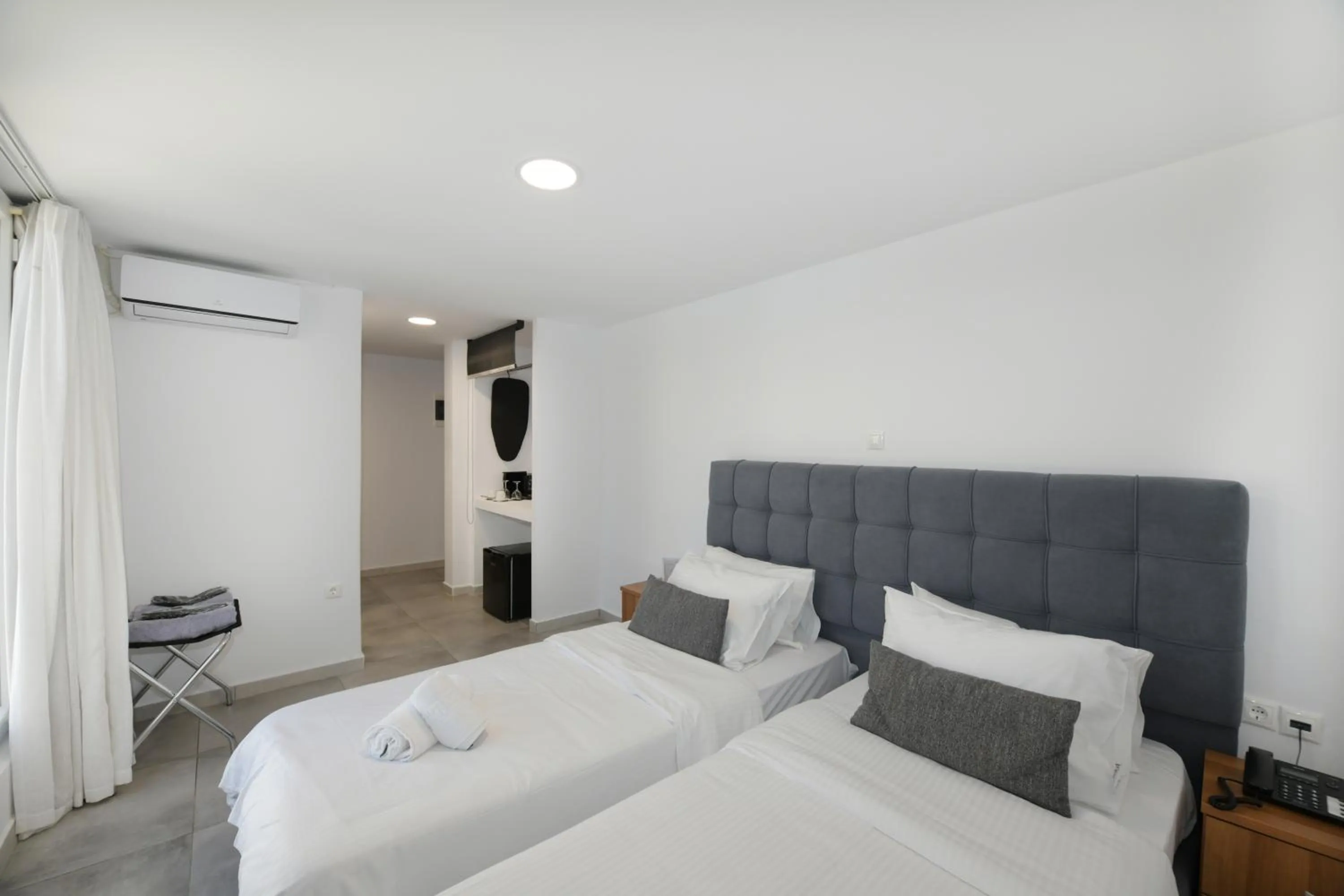 Bed in Mykonos Kosmoplaz Beach Resort Hotel