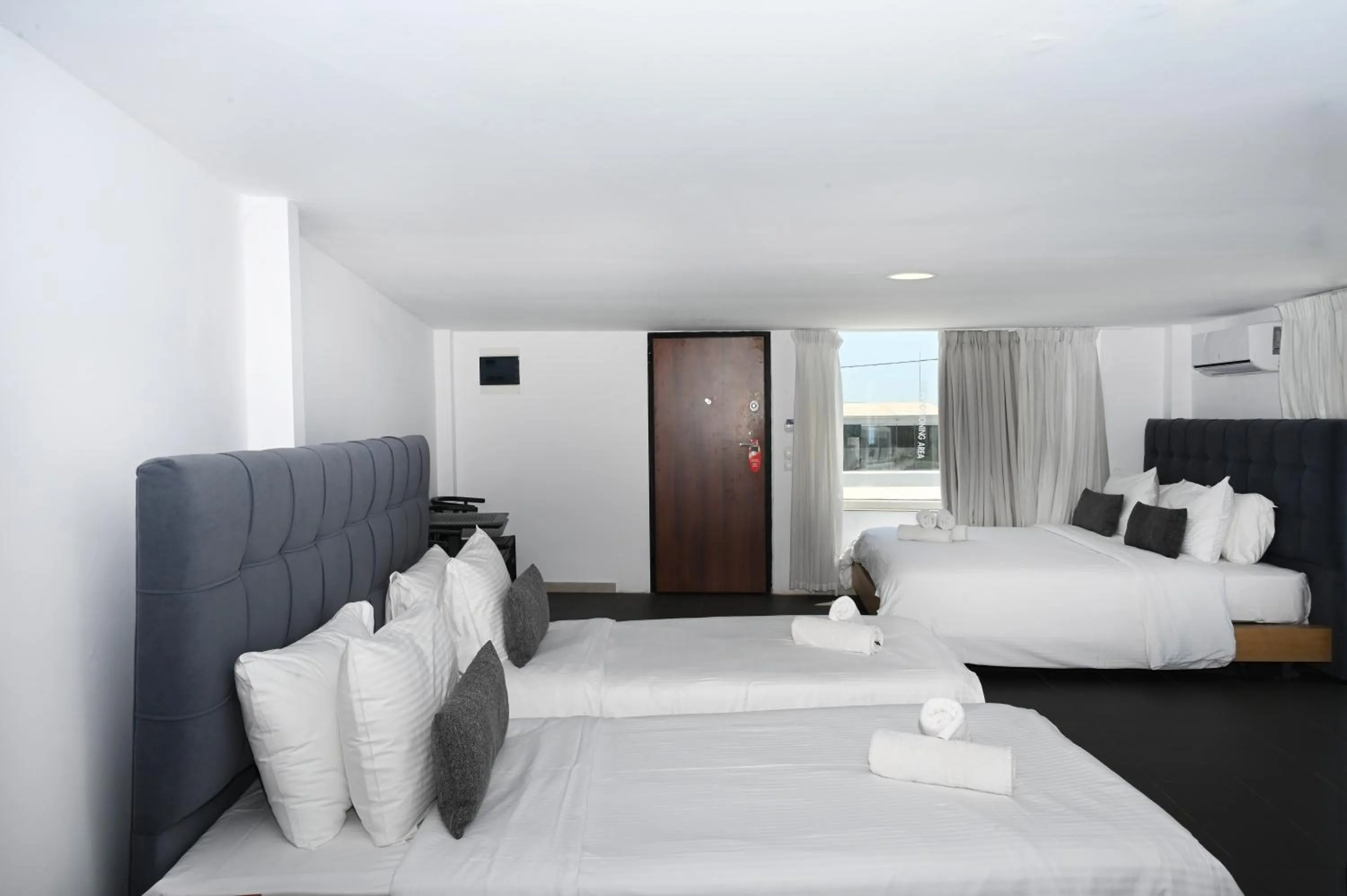 Bed in Mykonos Kosmoplaz Beach Resort Hotel