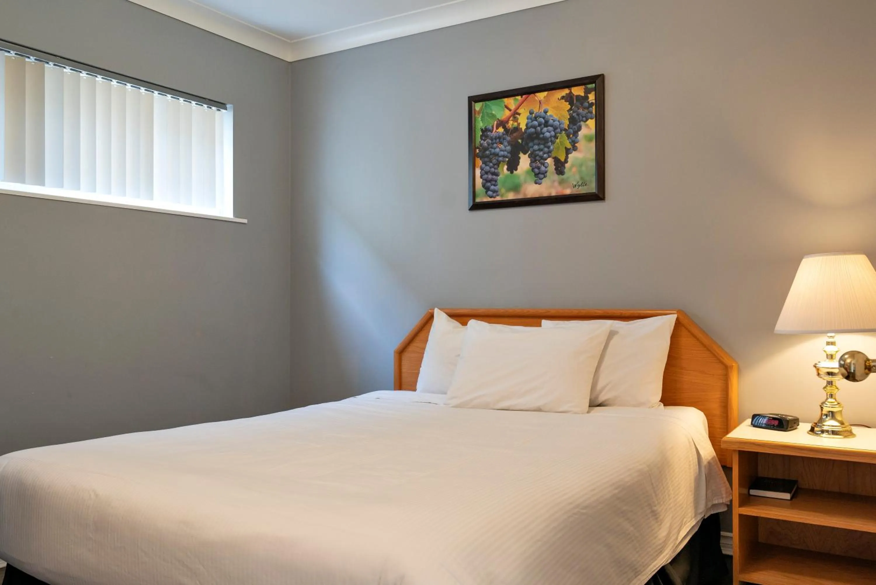 Bed in Tiki Shores Inn & Suites