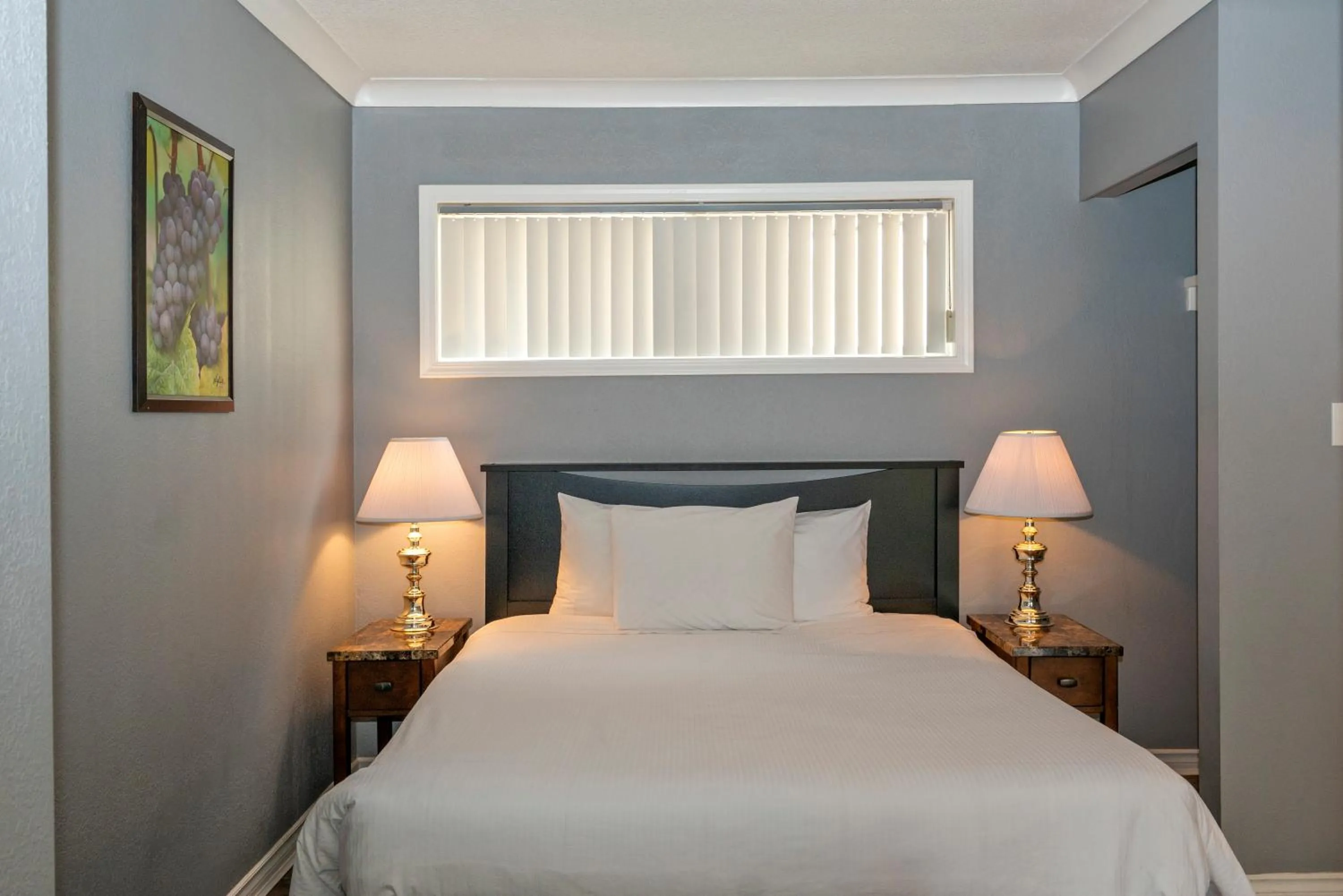 Bed in Tiki Shores Inn & Suites