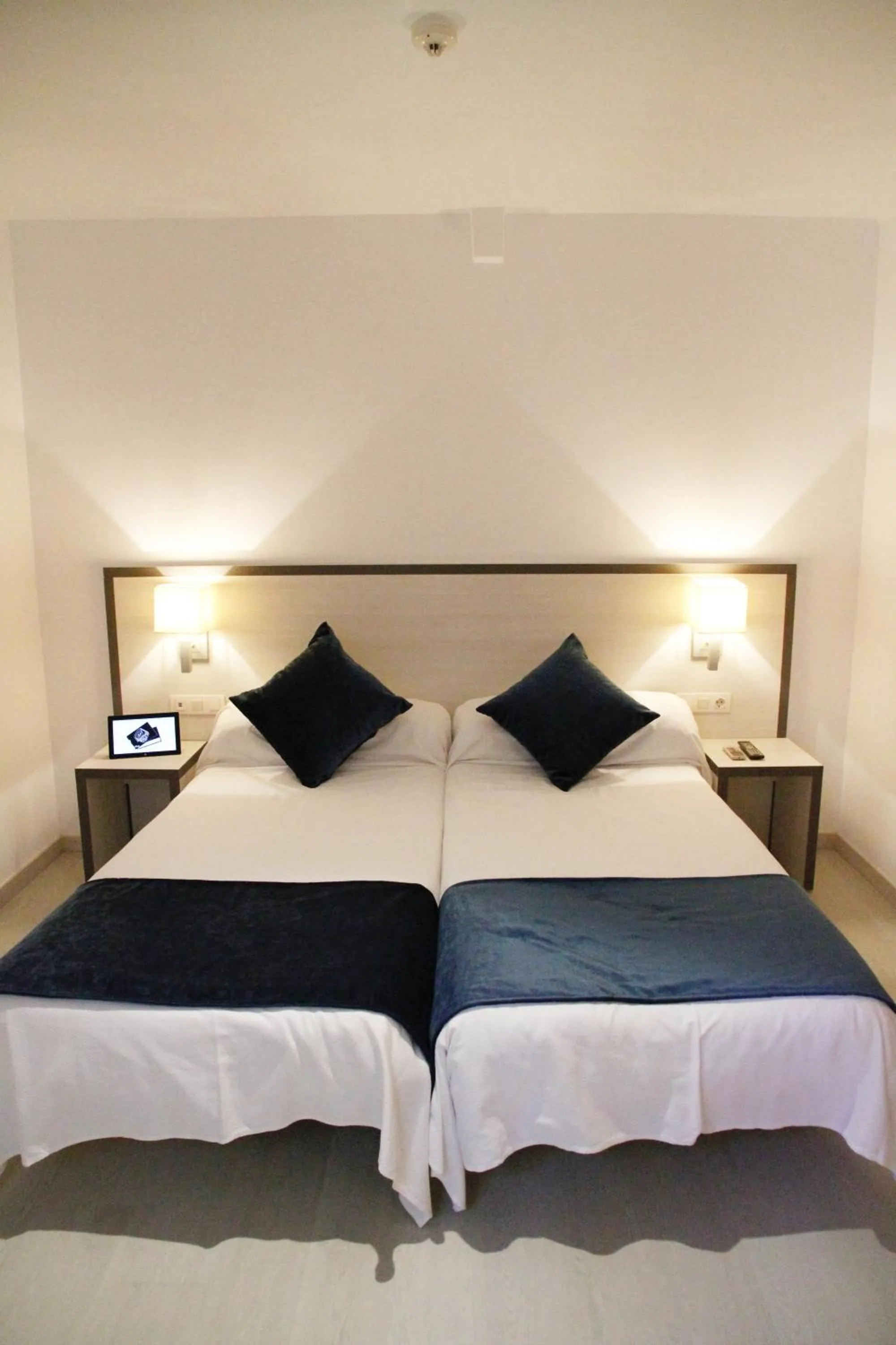 Bed in Parrots Sitges Hotel