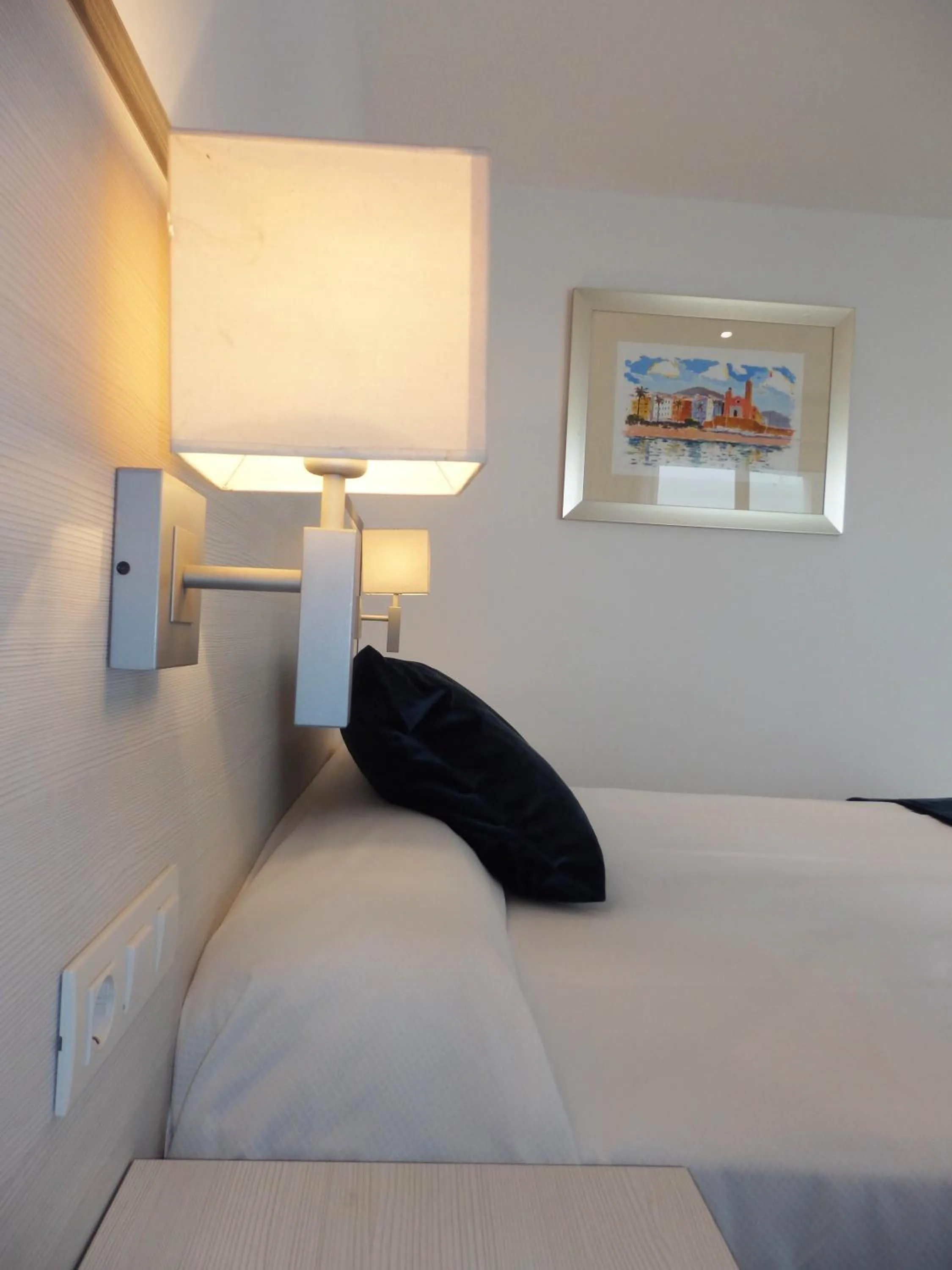 Bed in Parrots Sitges Hotel