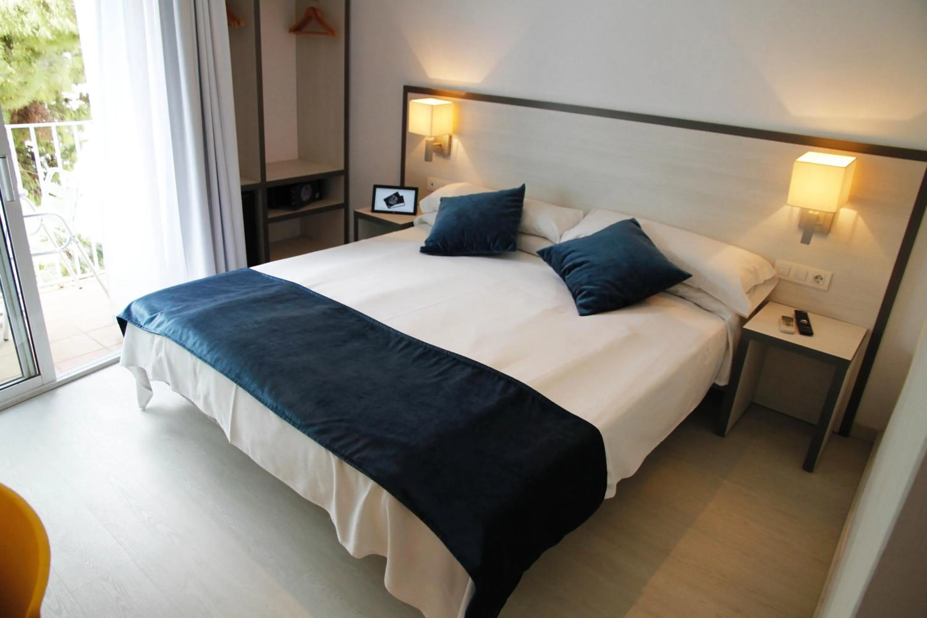 Bed in Parrots Sitges Hotel