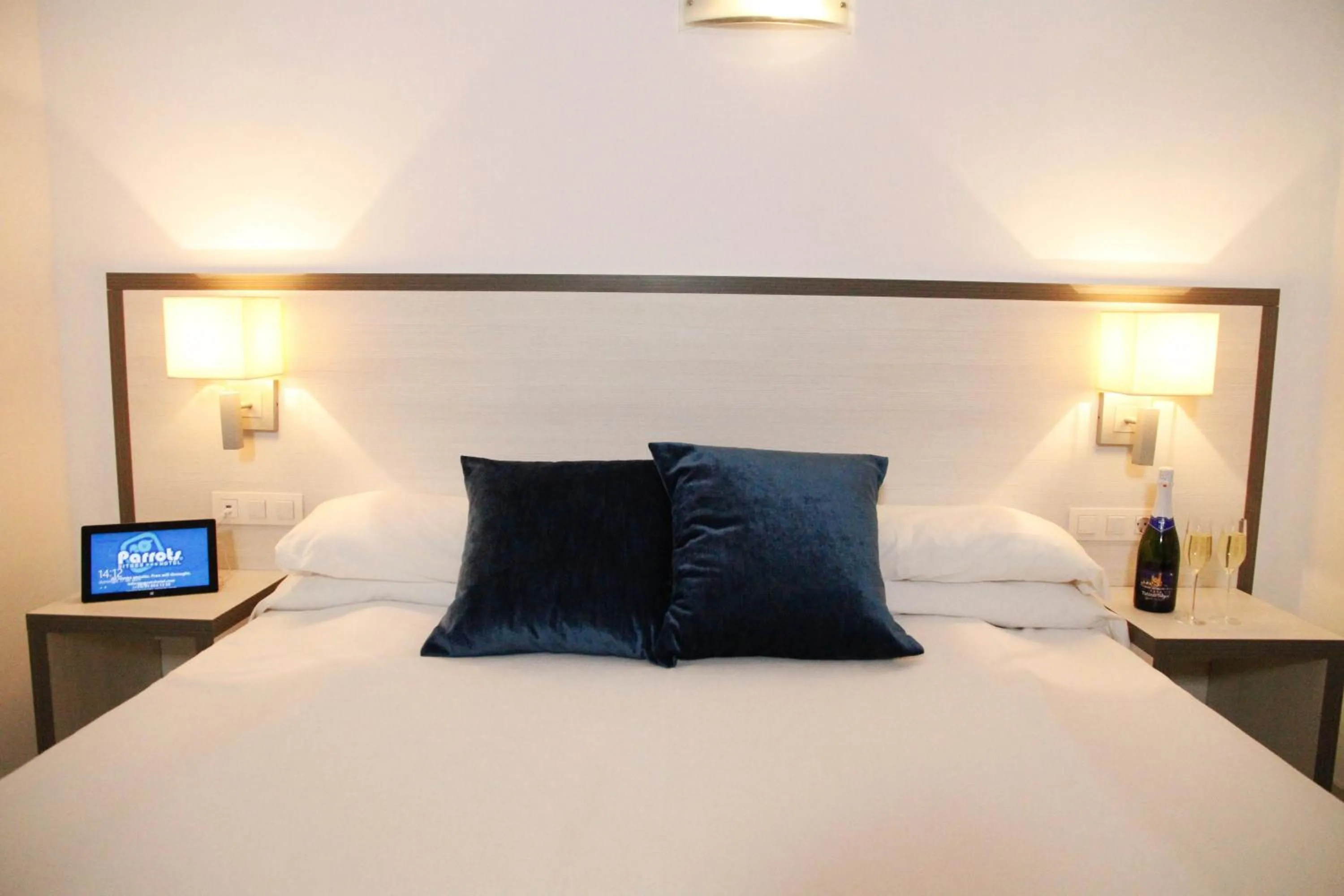 Bed in Parrots Sitges Hotel