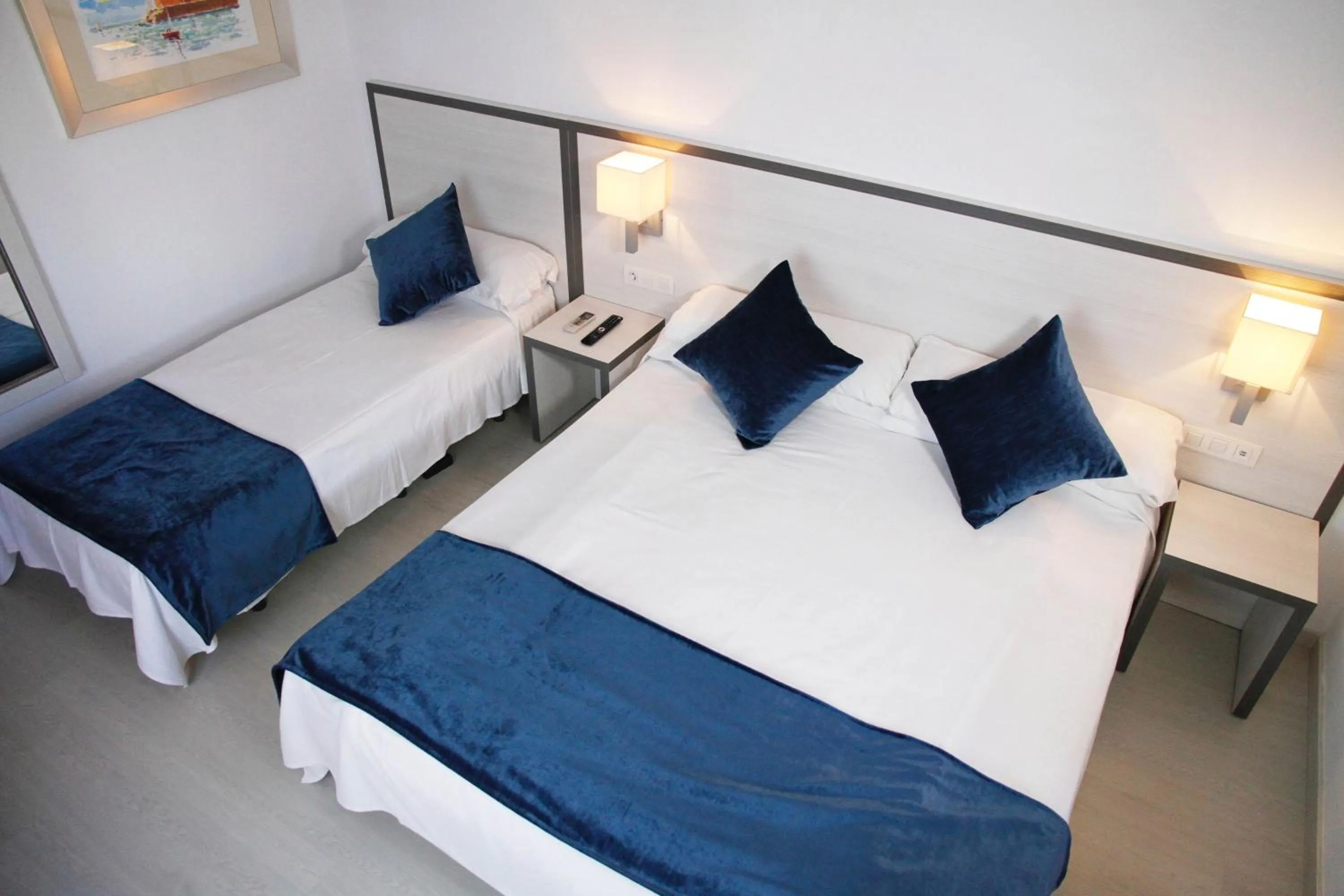 Bed in Parrots Sitges Hotel