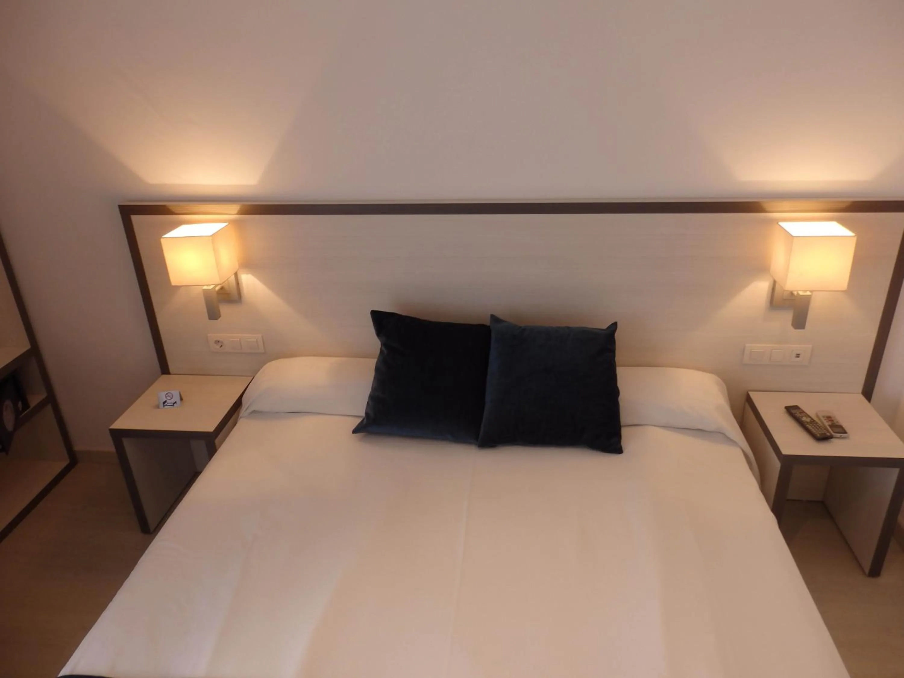 Bed in Parrots Sitges Hotel