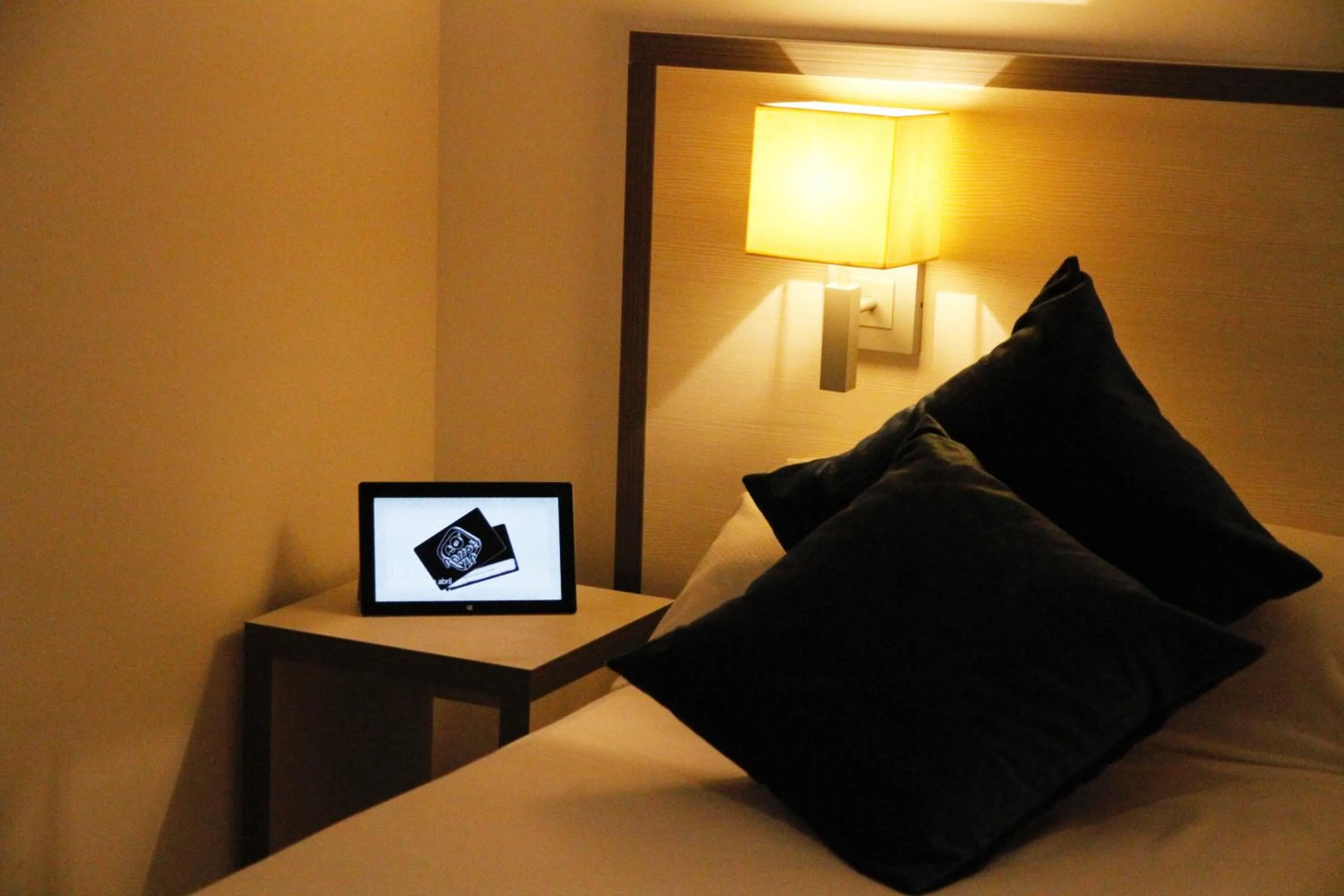 Bed in Parrots Sitges Hotel