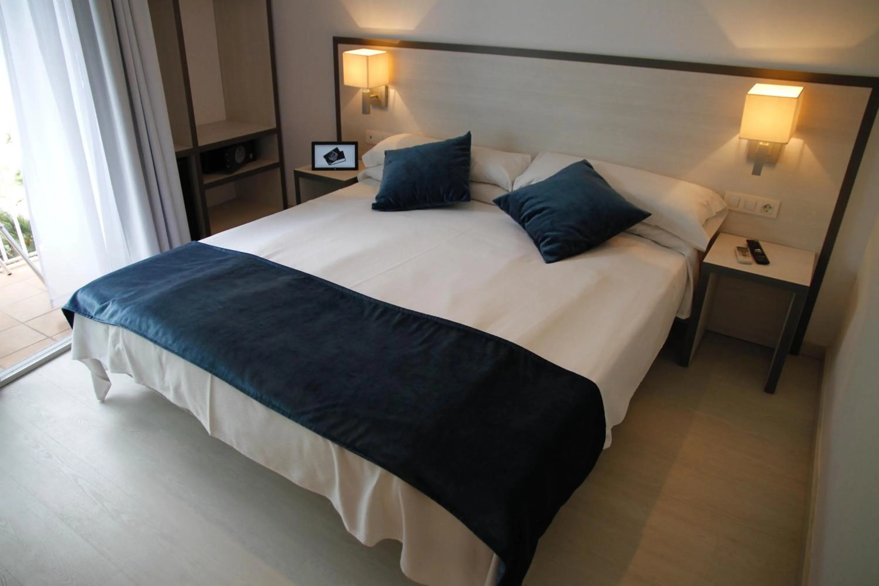 Bed in Parrots Sitges Hotel