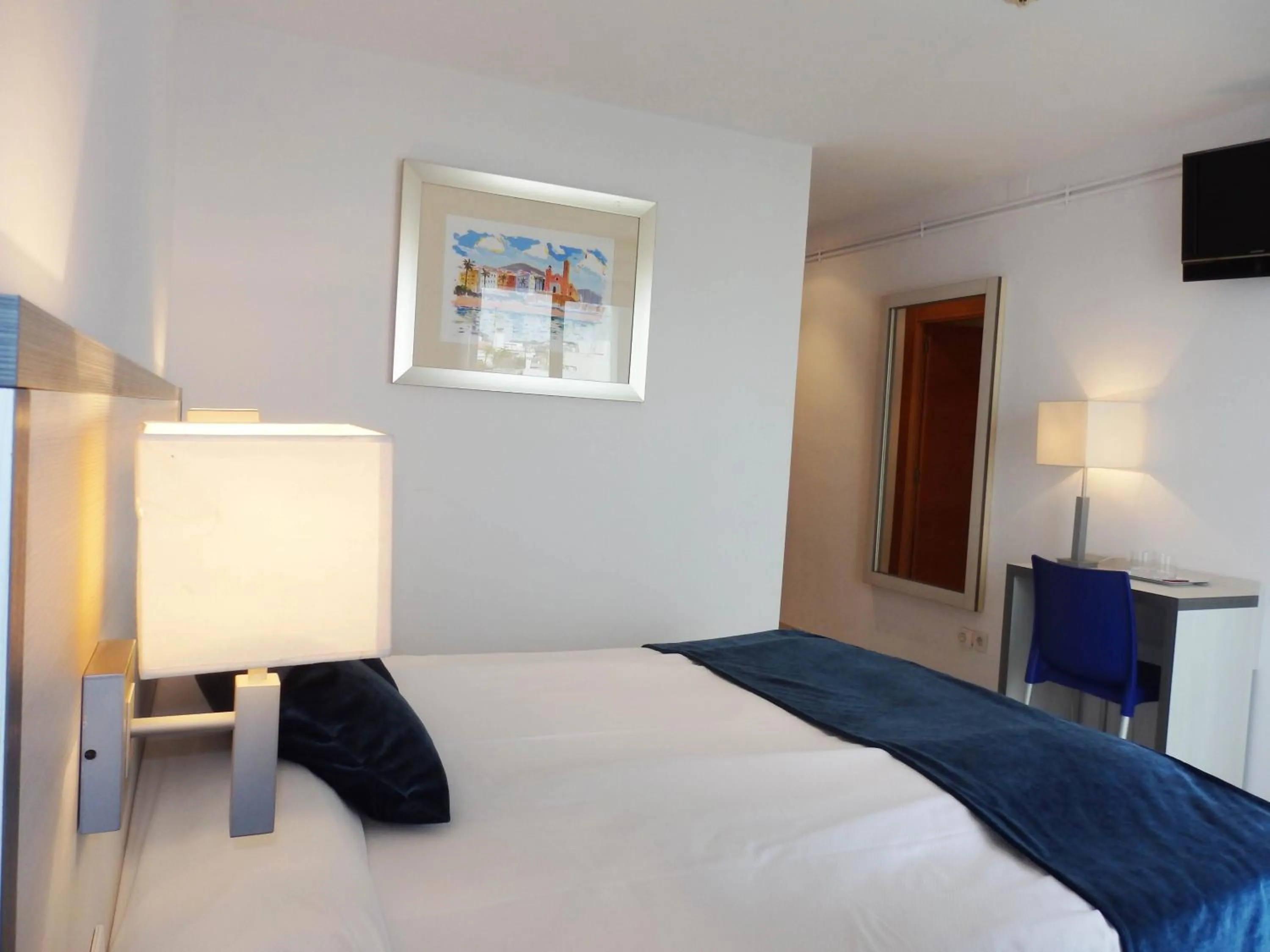 Bed in Parrots Sitges Hotel