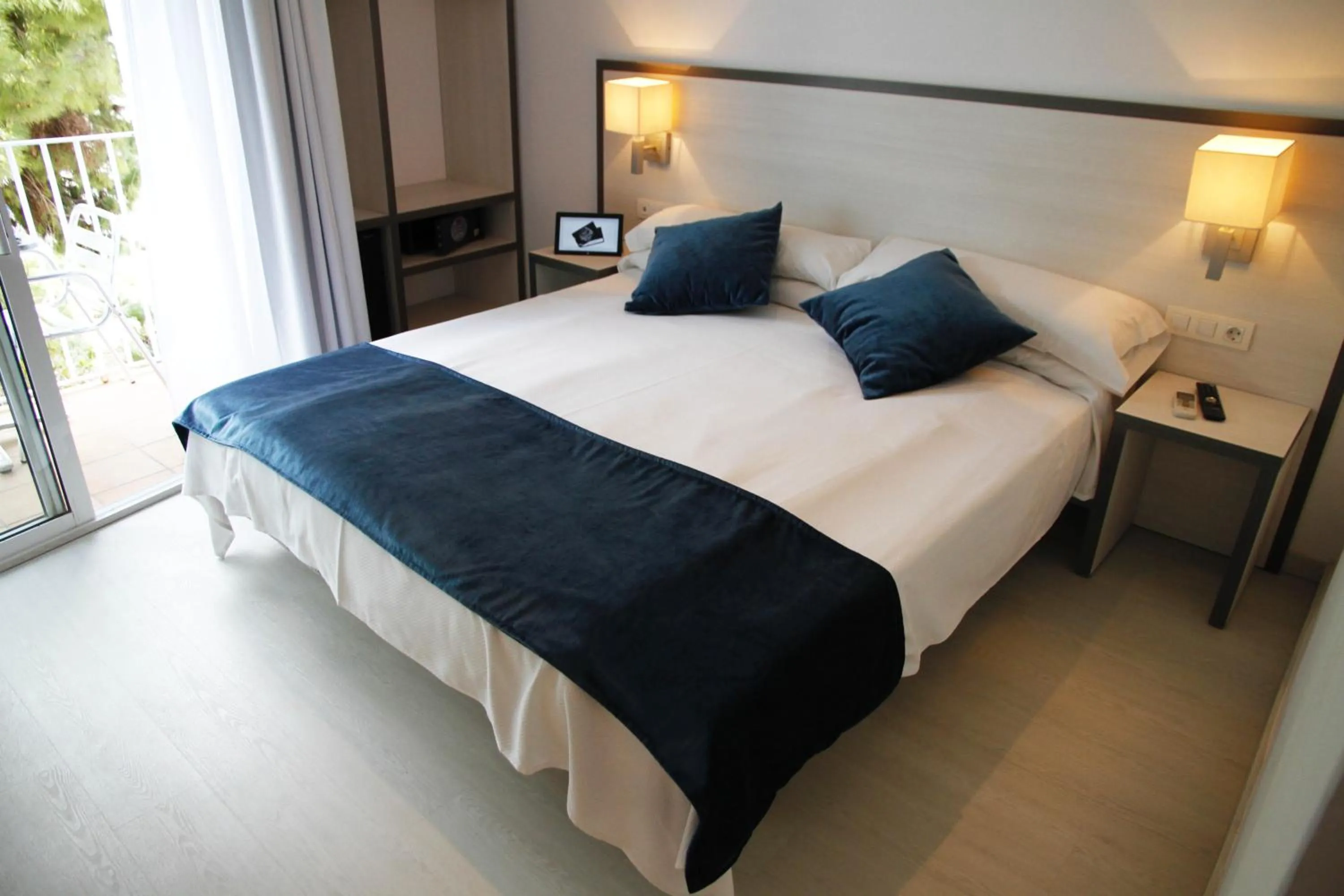 Bed in Parrots Sitges Hotel