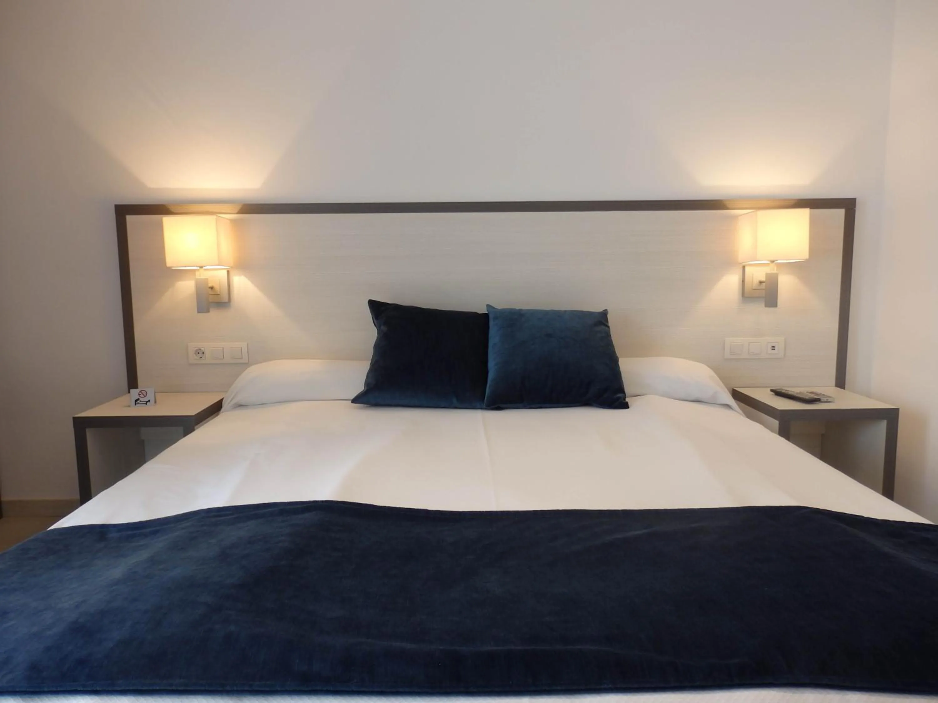 Bed in Parrots Sitges Hotel