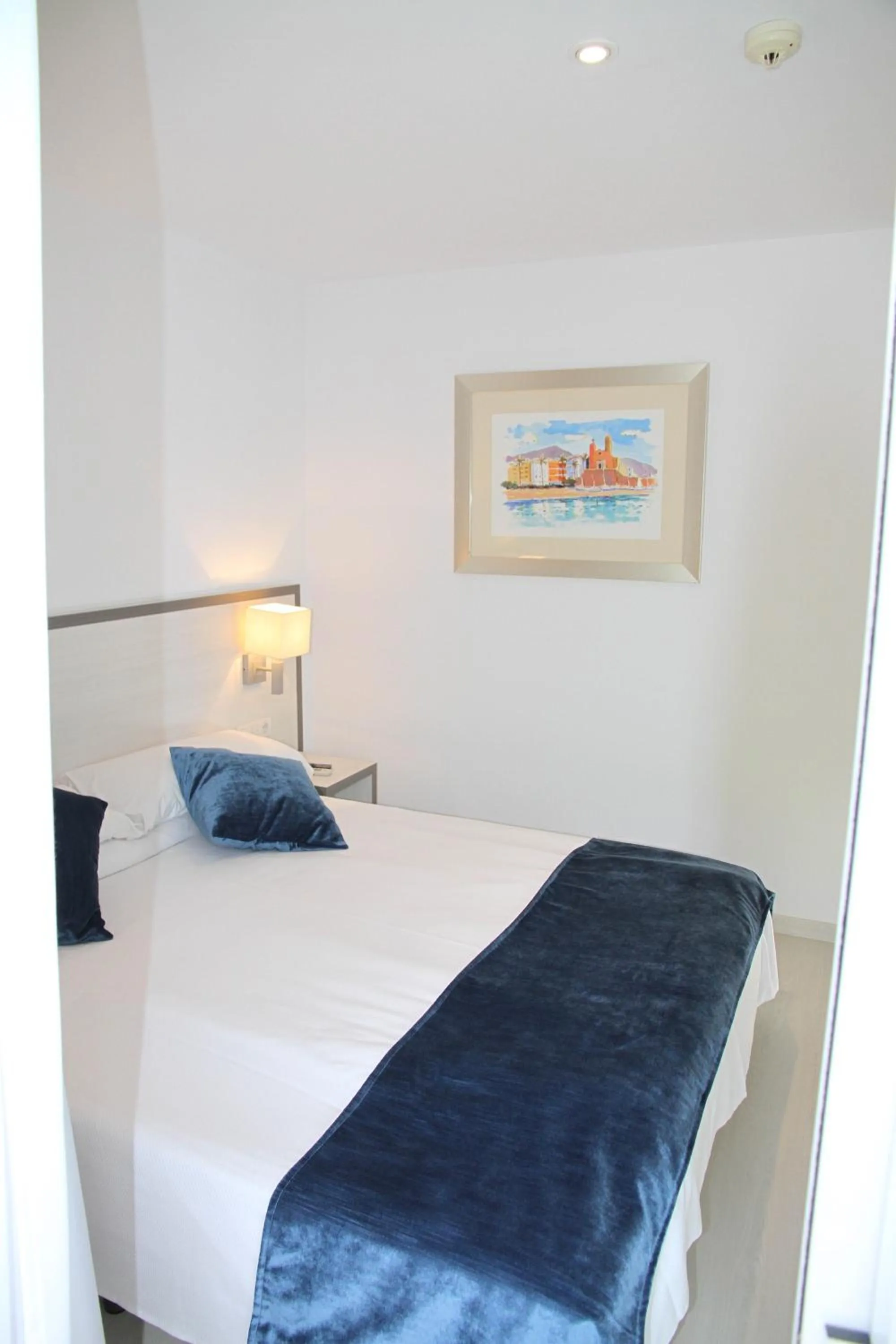 Bed in Parrots Sitges Hotel