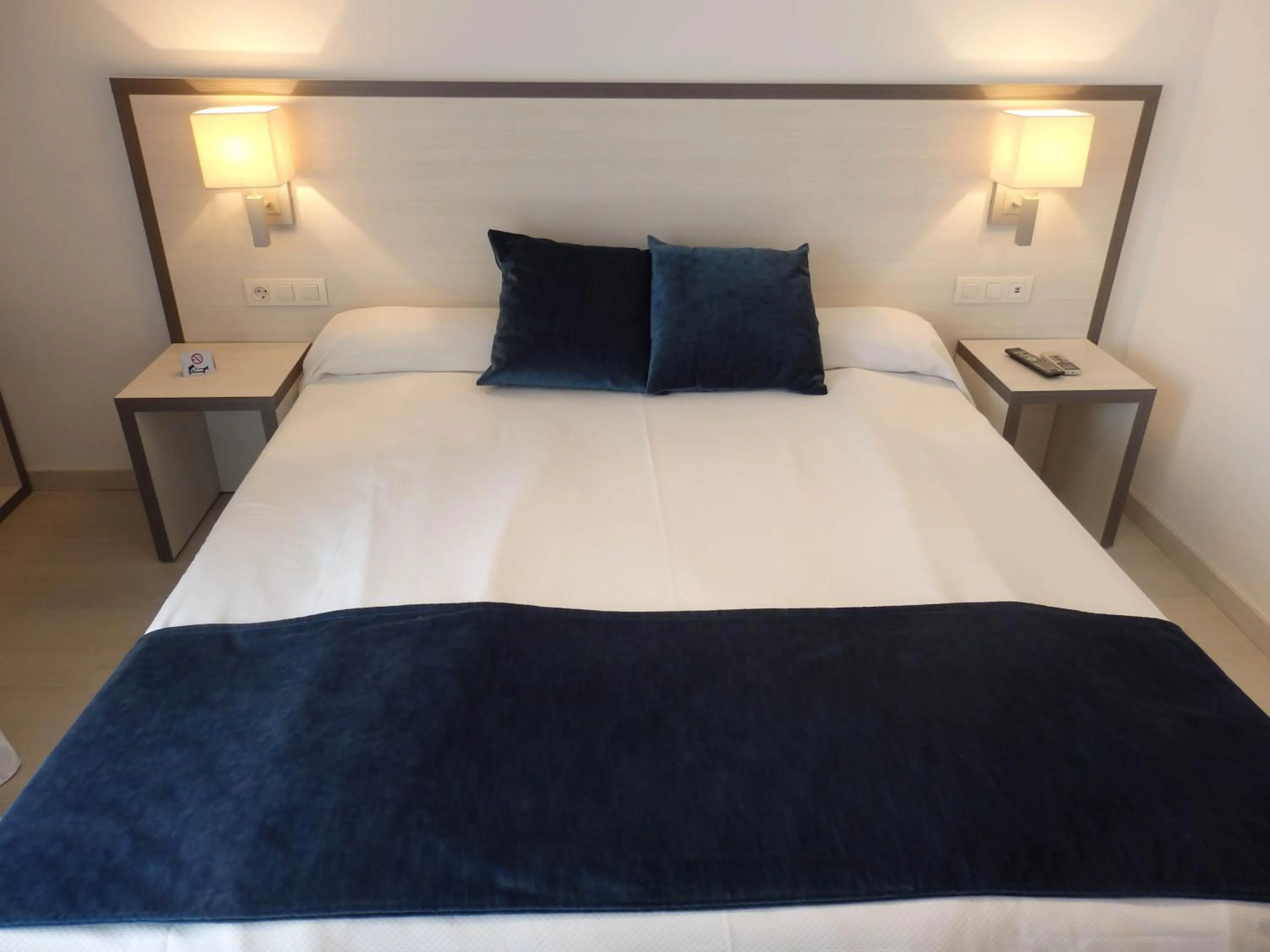 Bed in Parrots Sitges Hotel