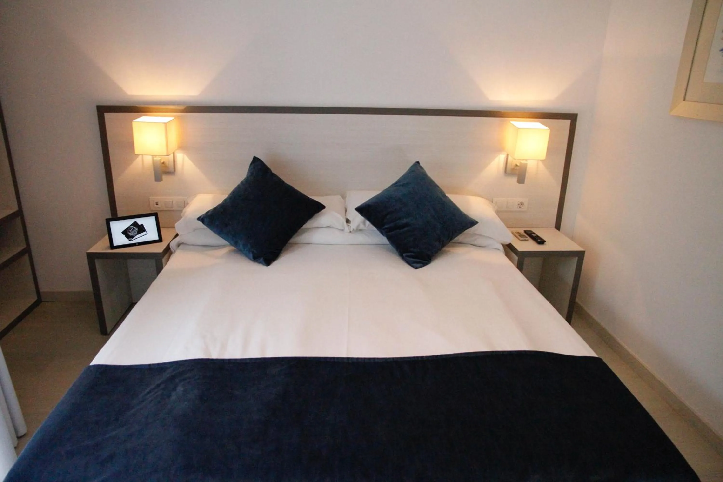 Bed in Parrots Sitges Hotel