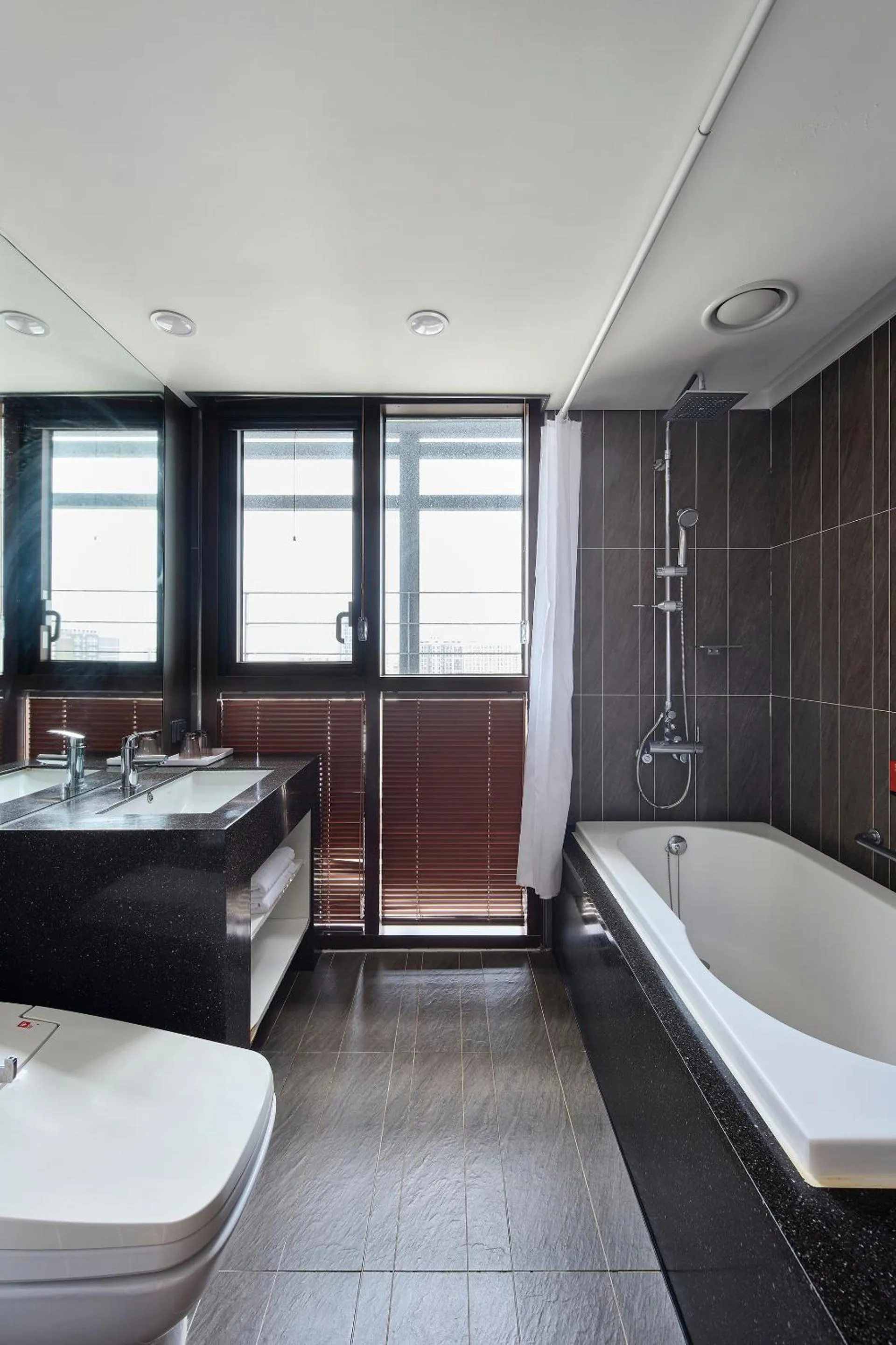 Toilet, Bed in Jeju Central City Hotel