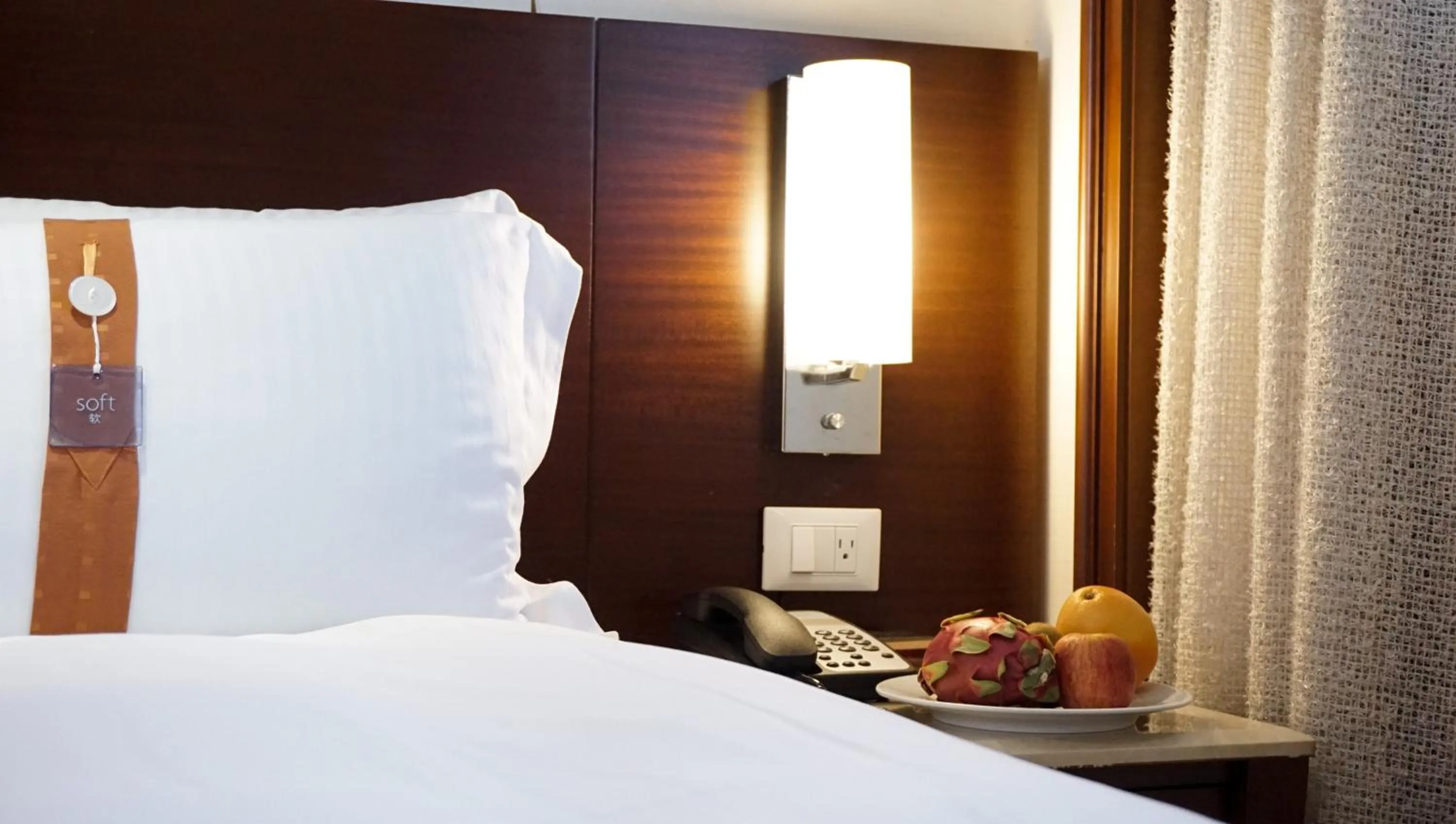 Bed in HiONE Holiday Hotel