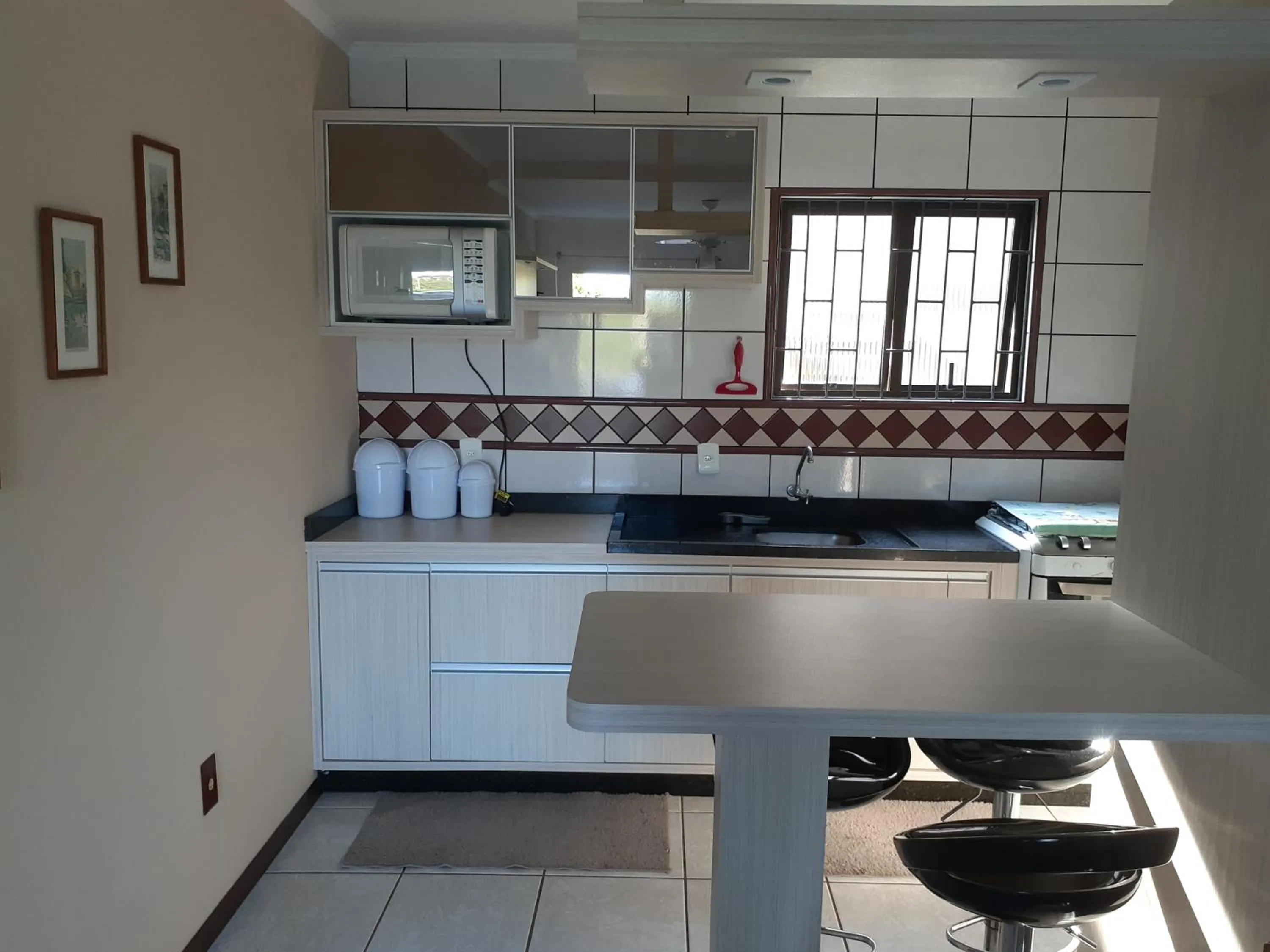 Kitchen or kitchenette in Casa da Marilú