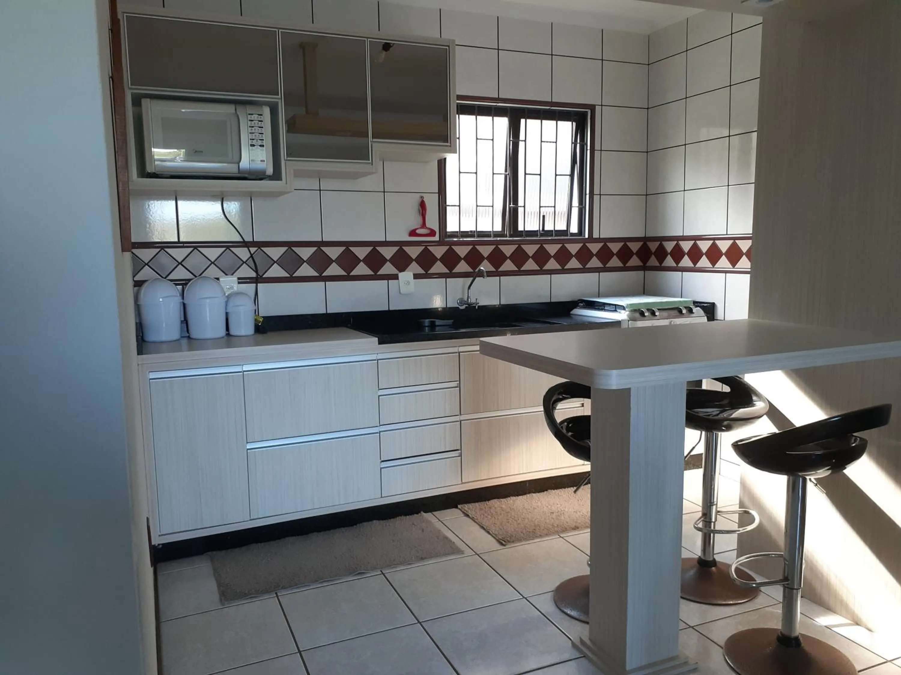 Kitchen or kitchenette in Casa da Marilú