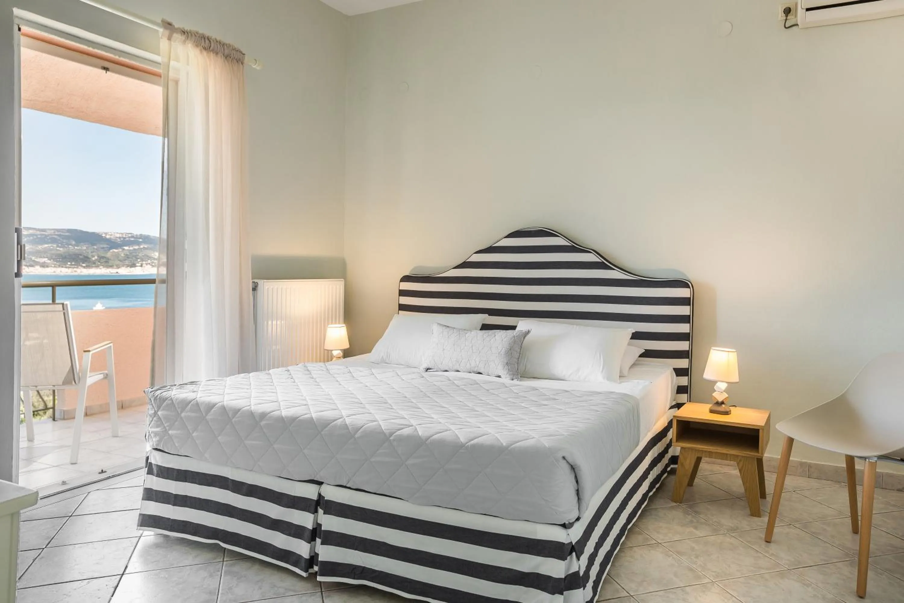 Bed in Panorama Fanari studios and apartments