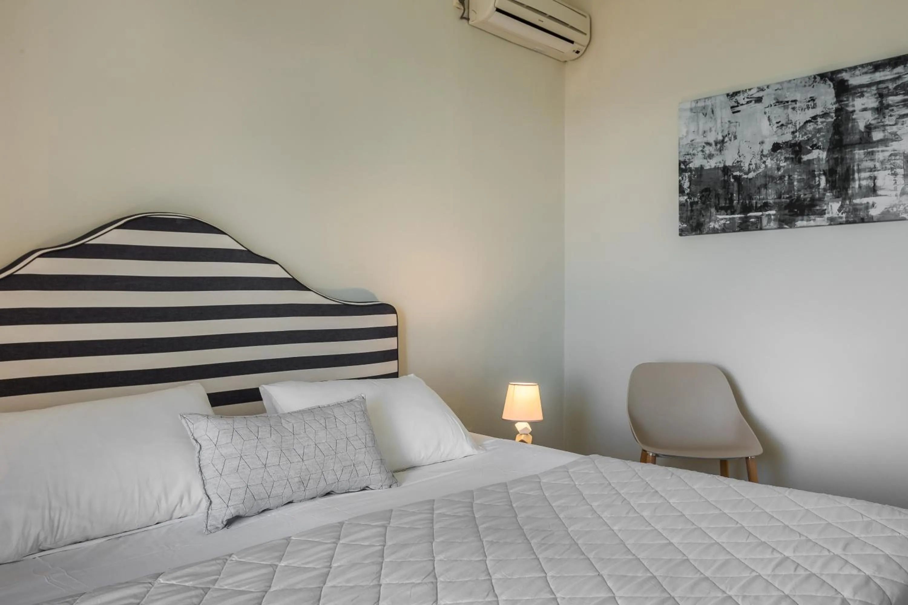 Bed in Panorama Fanari studios and apartments