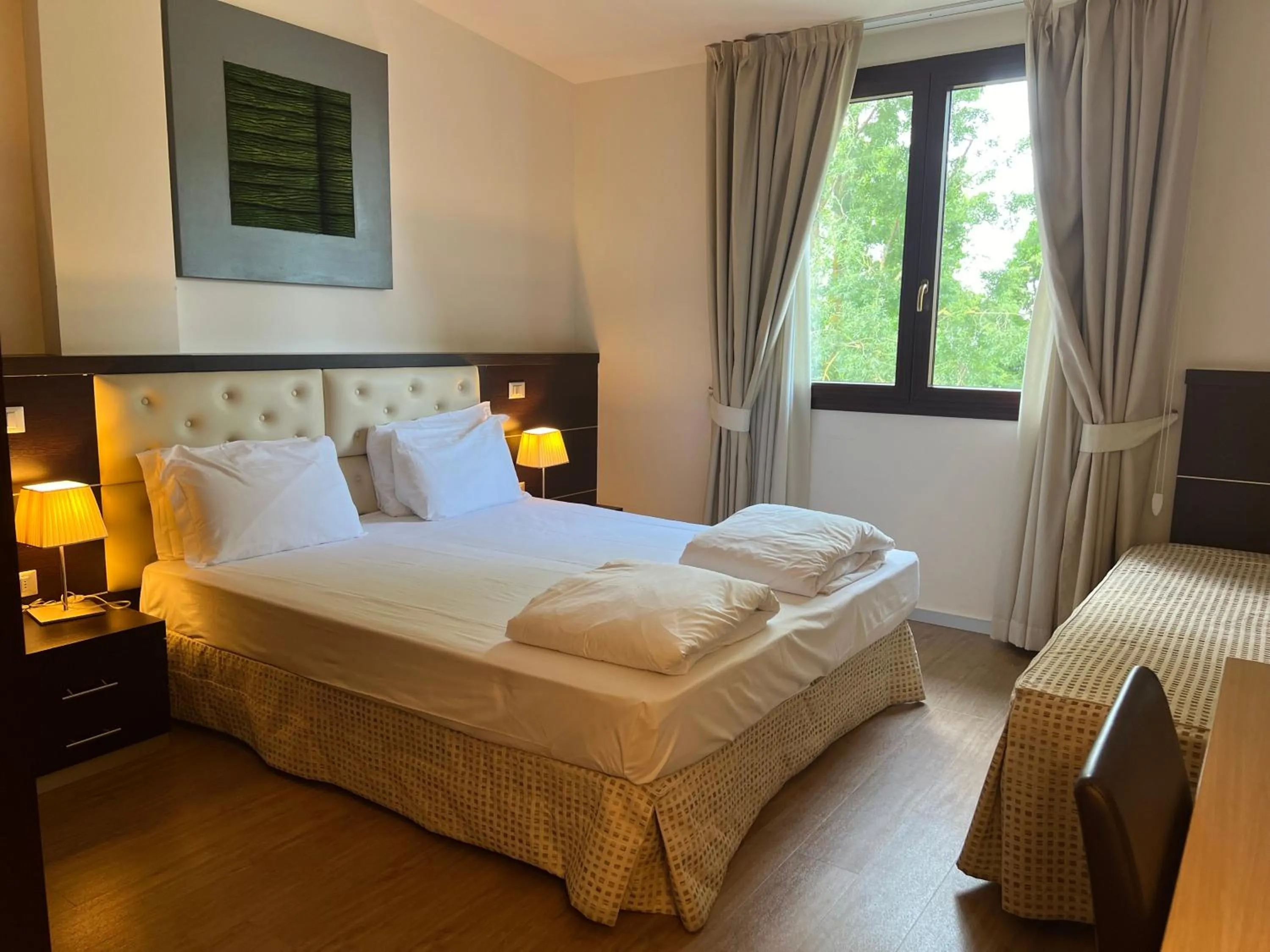 Bed in GREEN GARDEN Resort - Smart Hotel
