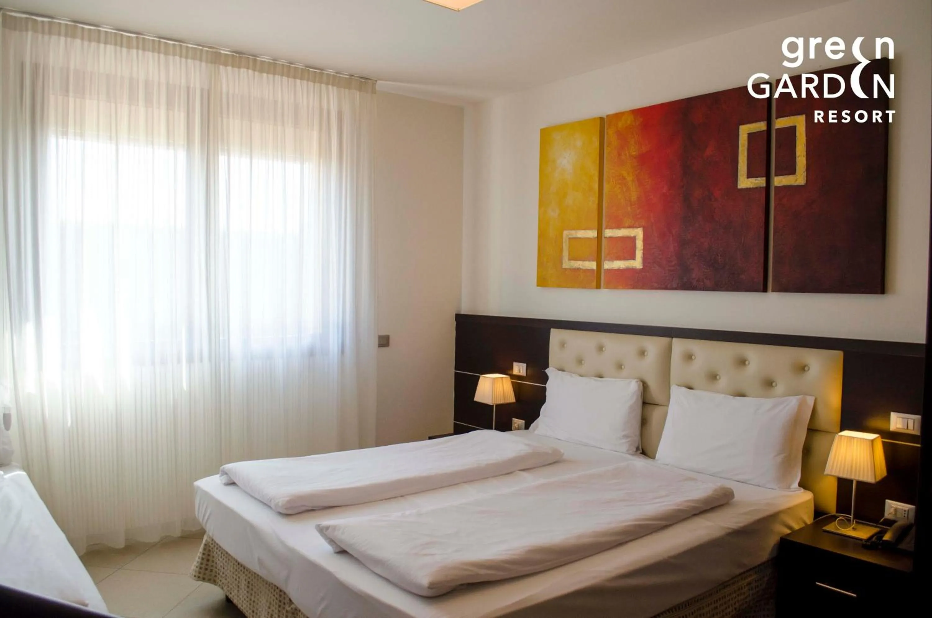 Bed in GREEN GARDEN Resort - Smart Hotel