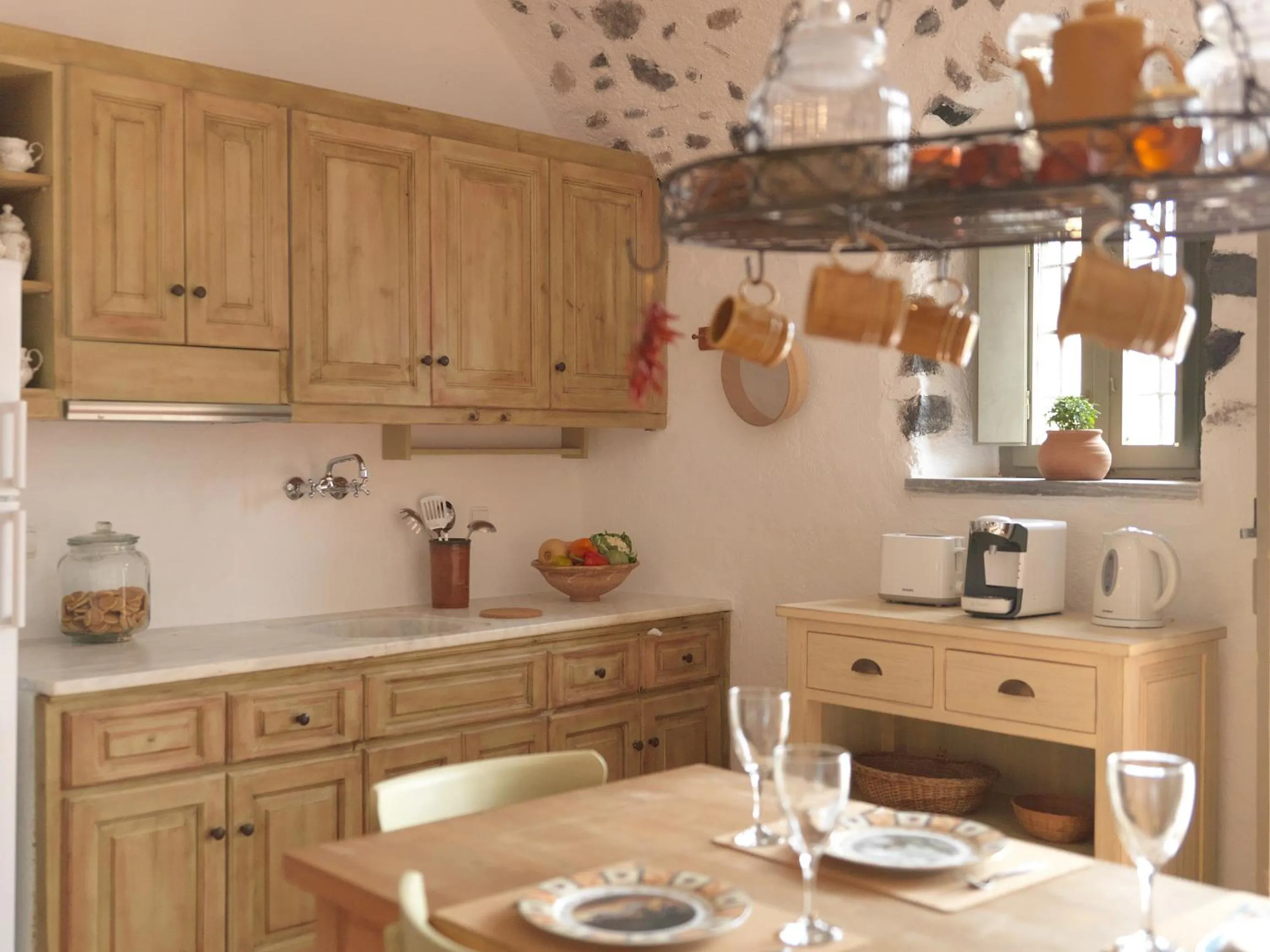 Kitchen or kitchenette in AFOURA HOUSES by K&K