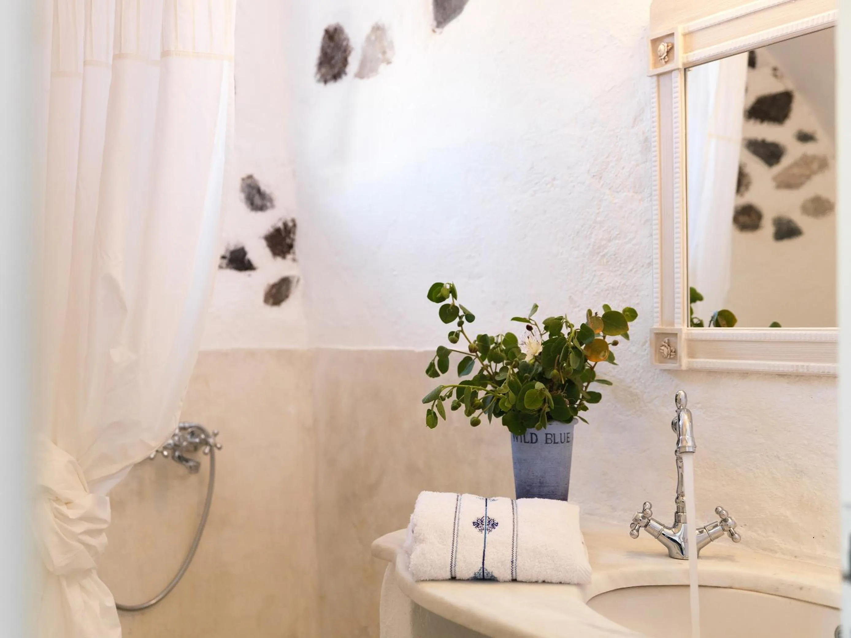 Bathroom in AFOURA HOUSES by K&K