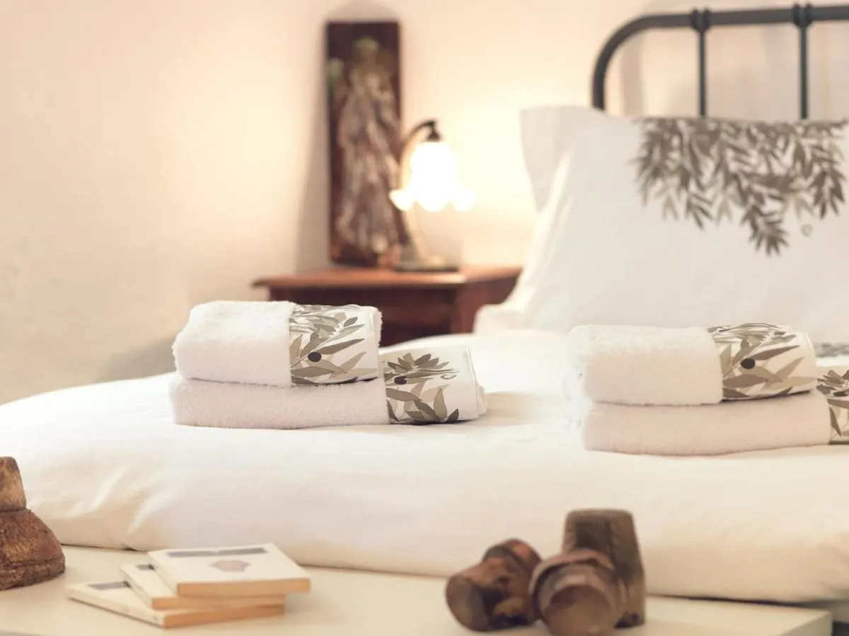 Bed in AFOURA HOUSES by K&K