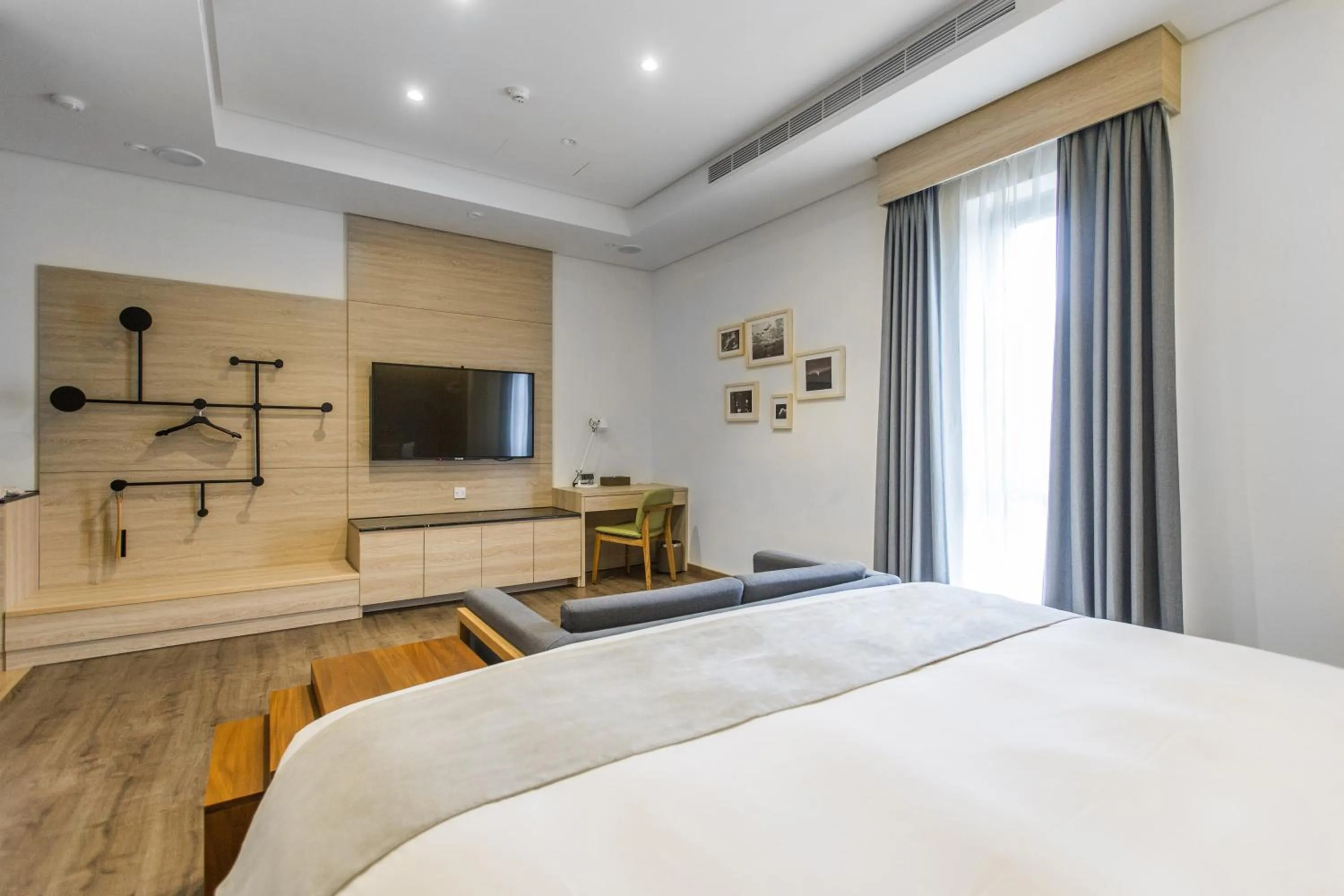 Photo of the whole room, Bed in Sun Dialogue Hotel-By Cosmos Creation