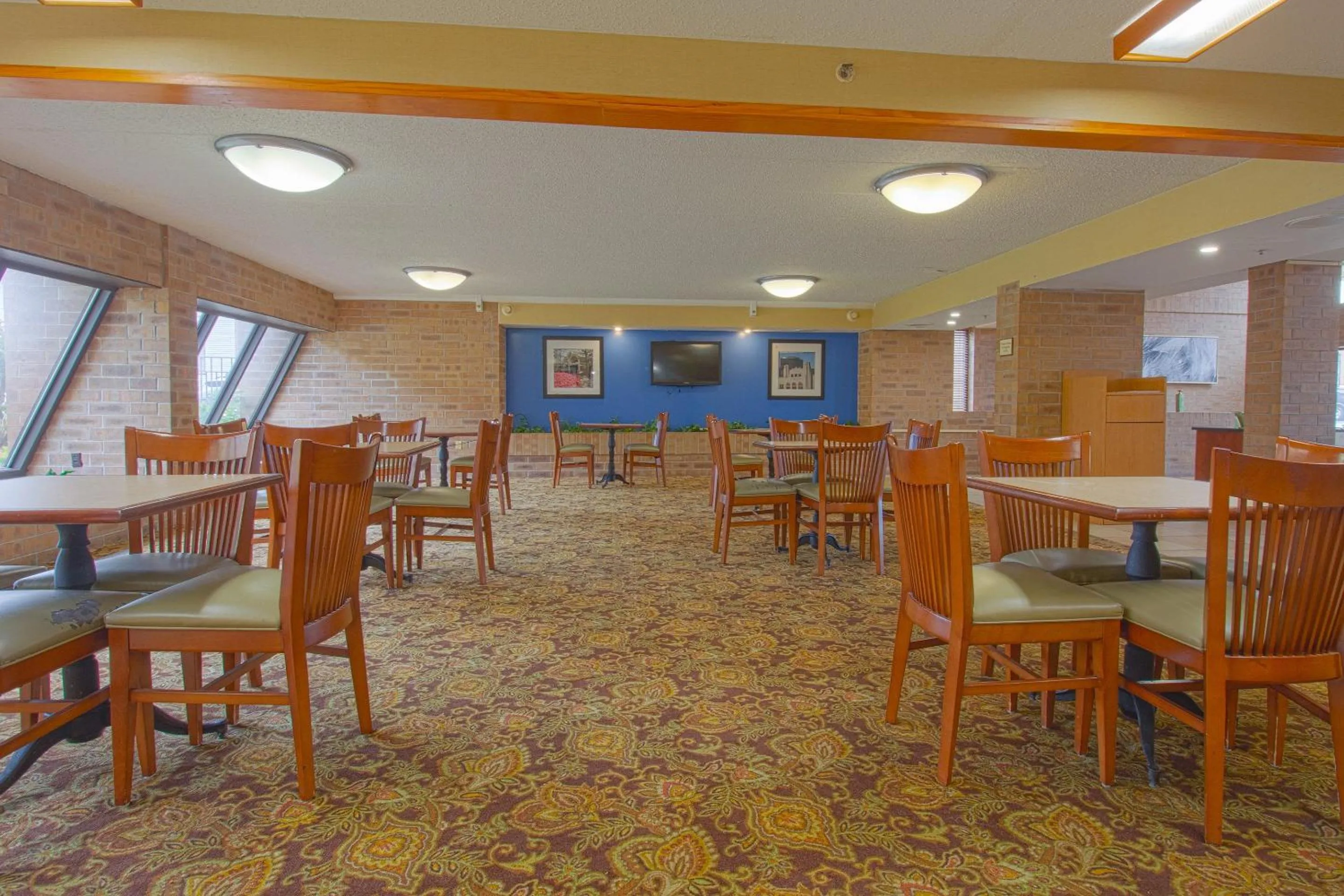 Dining area in Tulsa Square Hotel Central, I-44 By OYO